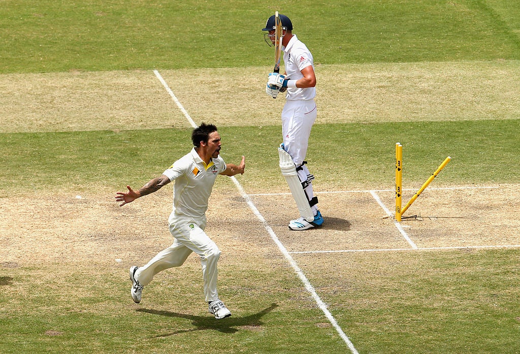 Mitchell Johnson of Australia celebrates after taking the wicket of Stuart Broad in December 2013