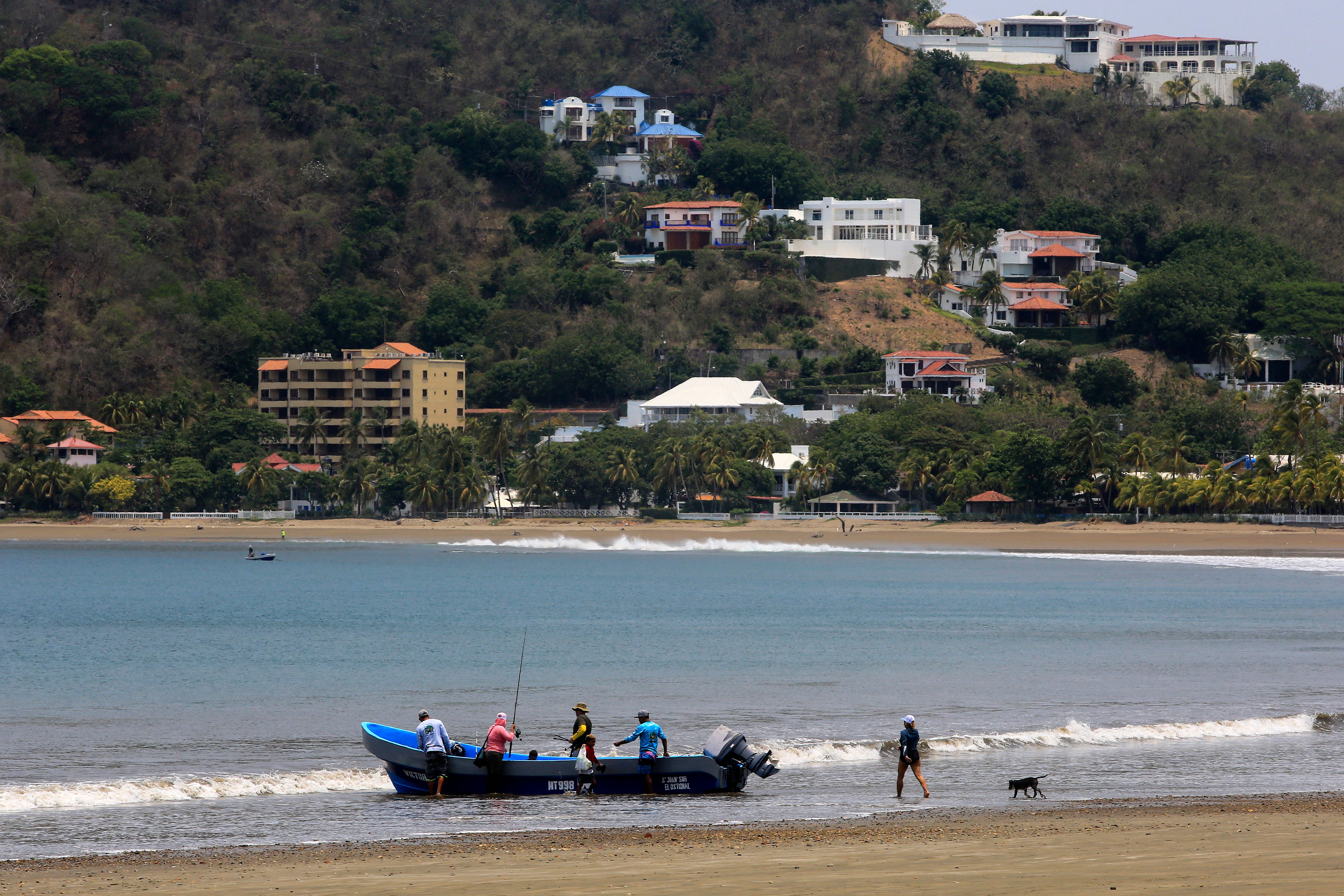 Tourists board a boat in the Pacific coastal town of San Juan del Sur, Nicaragua, on April 25, 2023