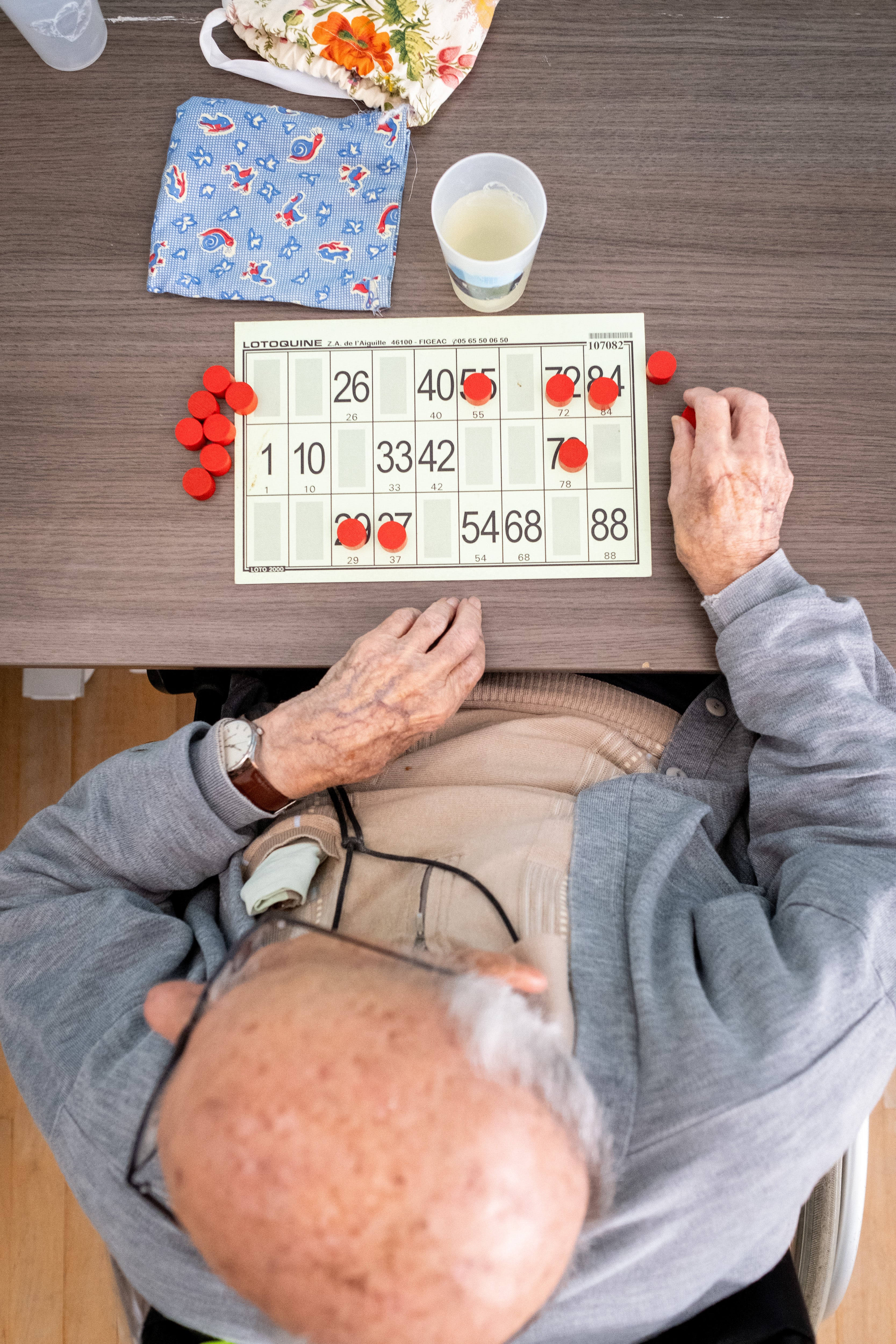 File. Resident participates in a bingo game at a retirement nursing care home
