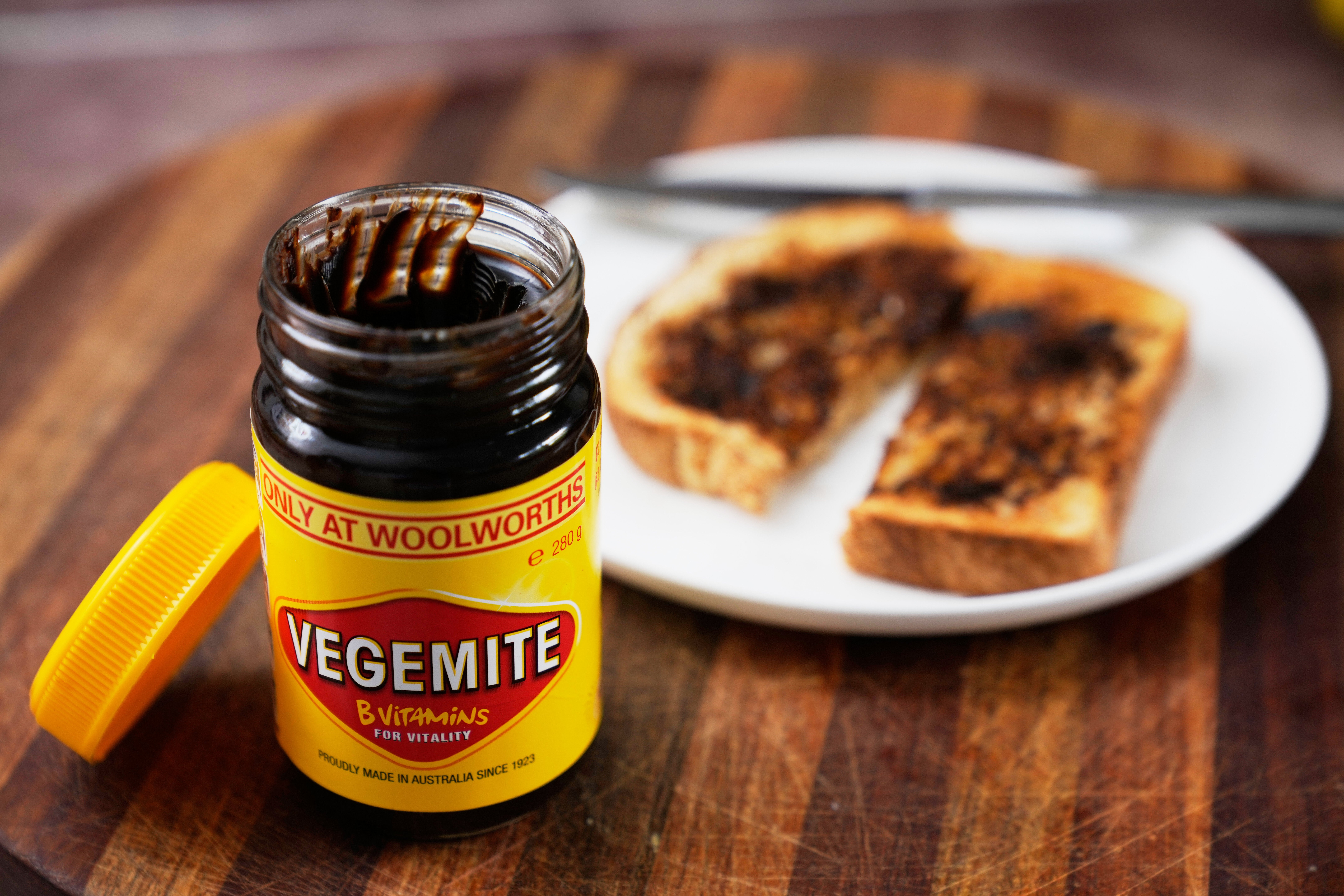 A piece of toast is prepared with Vegemite in Sydney, Australia, Monday, Nov. 17, 2025. (AP Photo/Rick Rycroft)