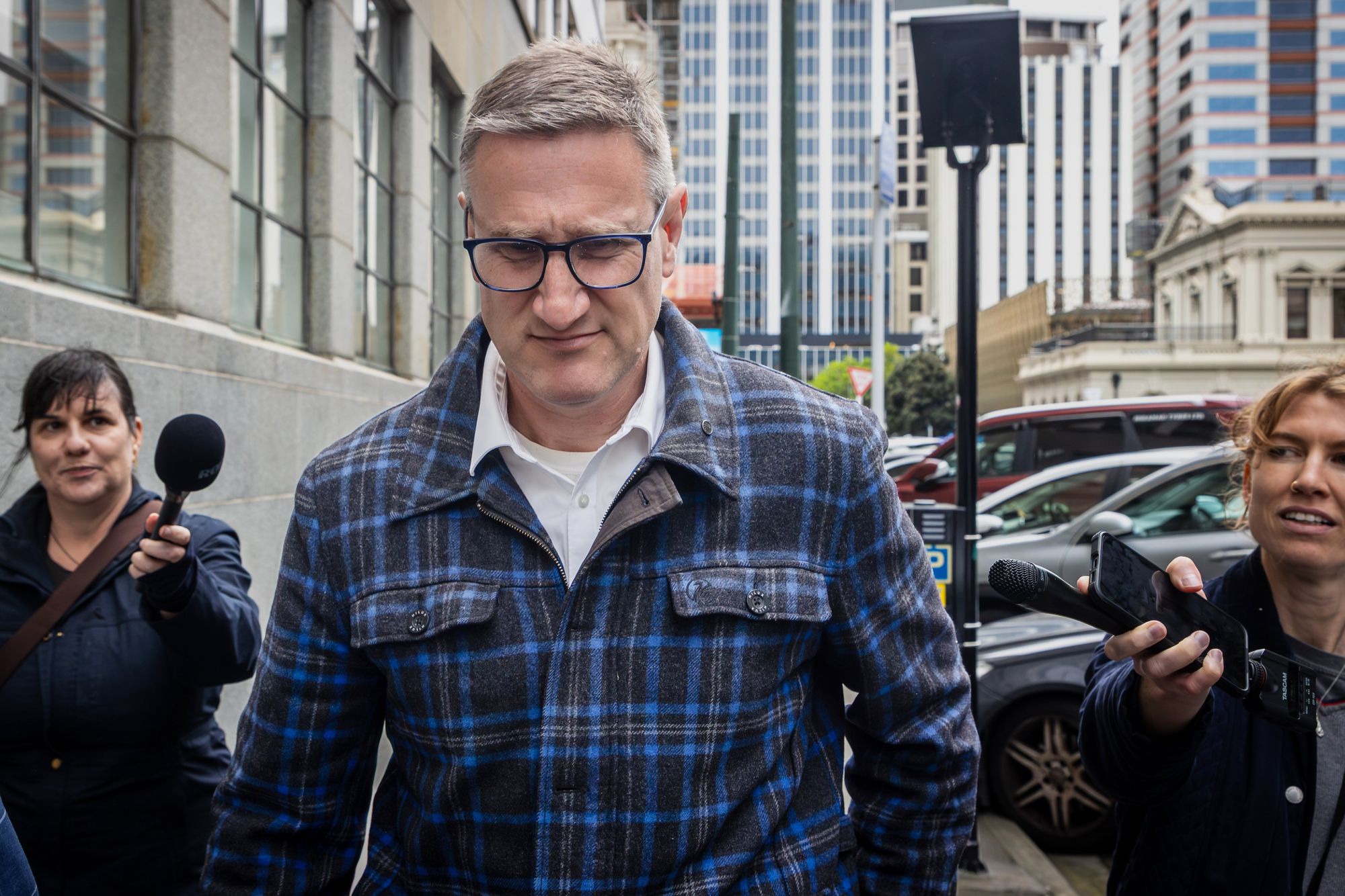 Former deputy police commissioner, Jevon McSkimming, walks from the High Court in Wellington, New Zealand
