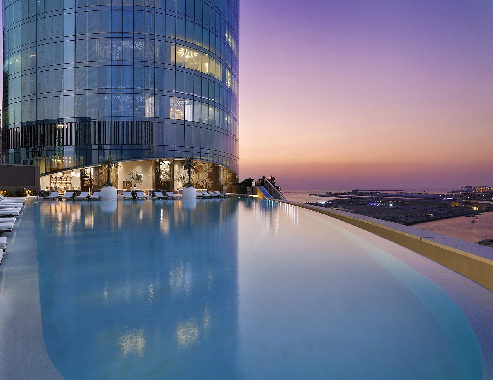 Ciel Dubai Marina's rooftop infinity pool at sunset