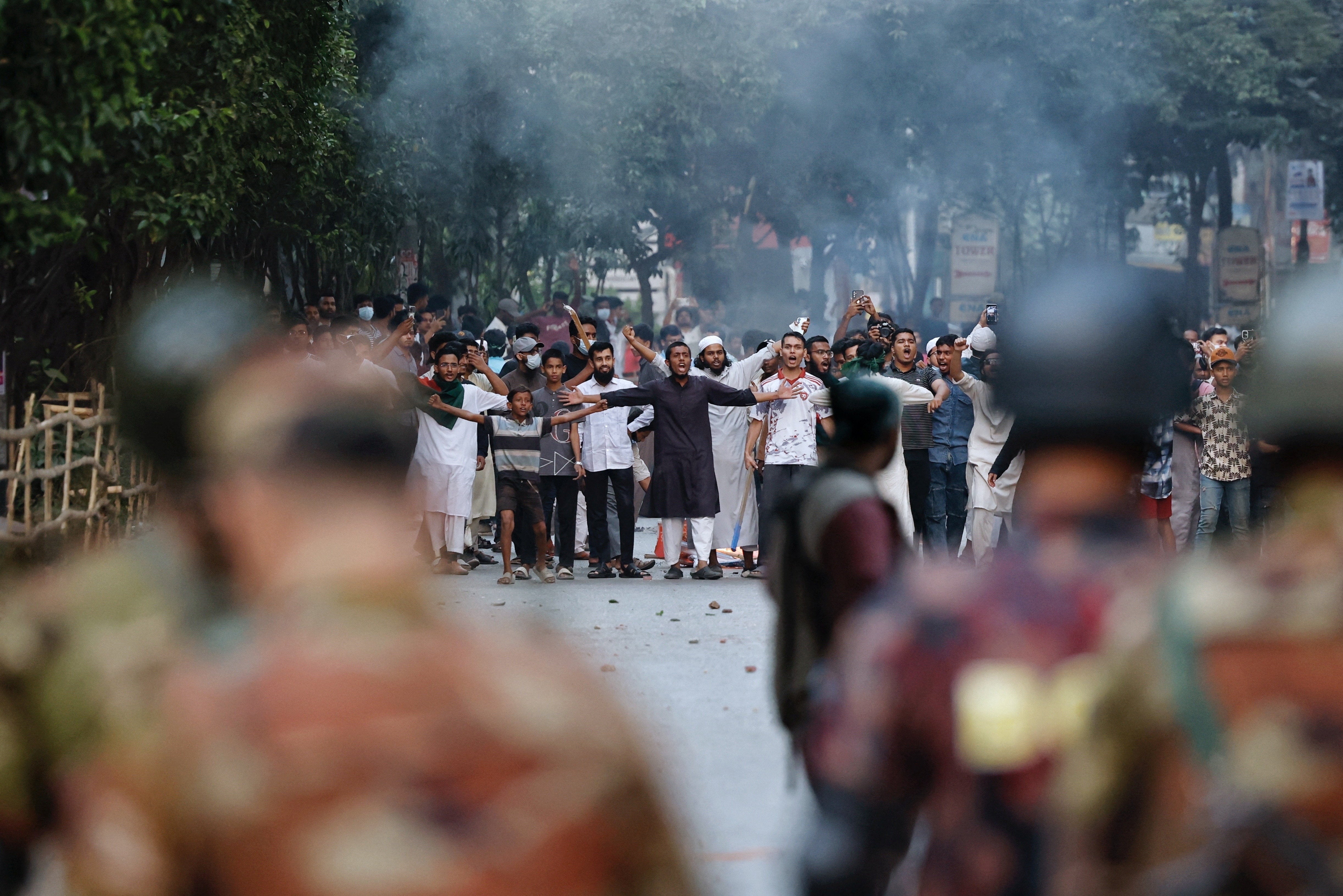 Protesters clash with security forces after a Dhaka tribunal sentences ousted leader Sheikh Hasina to death