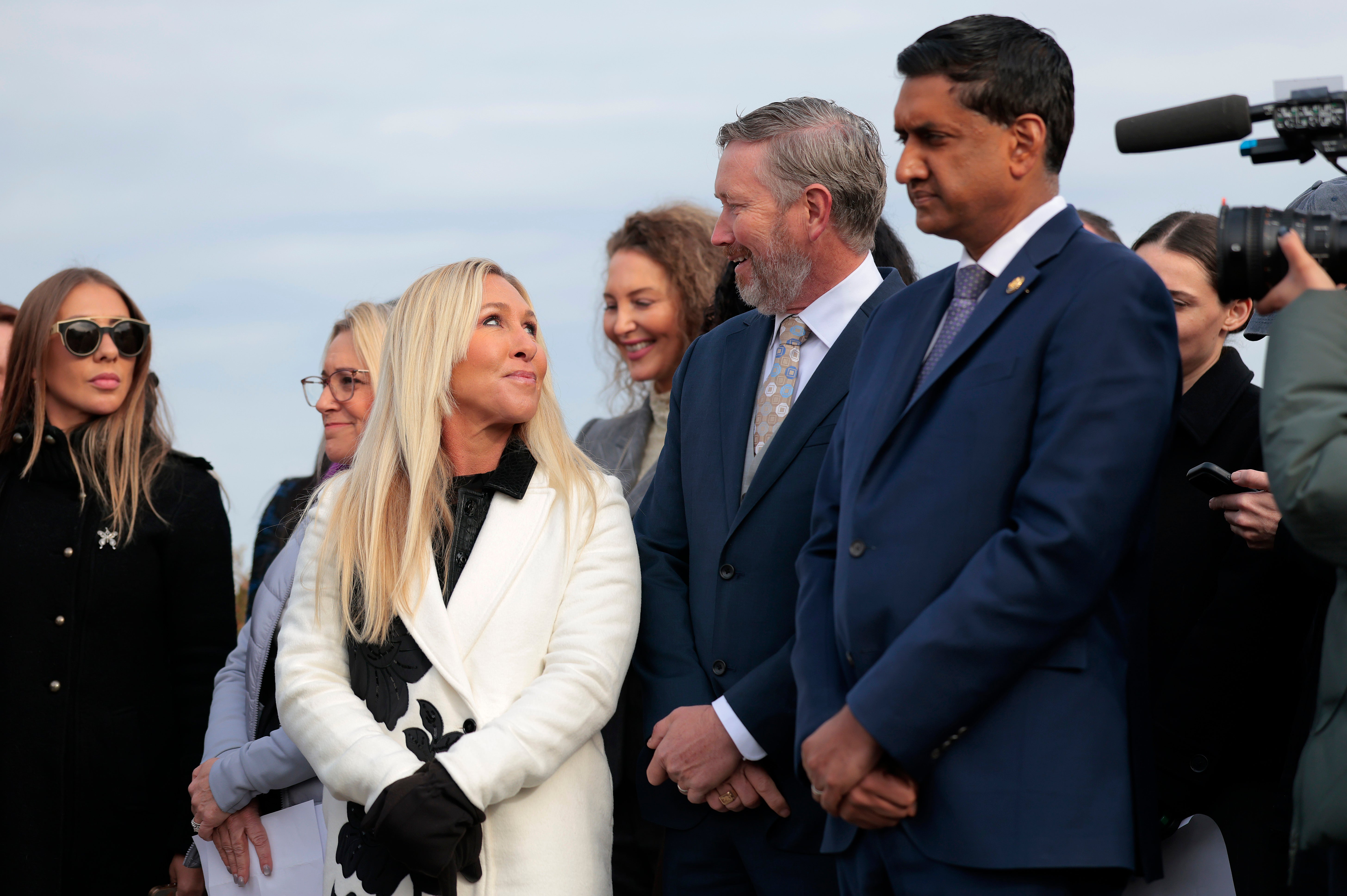 Rep. Ro Khanna, Rep. Marjorie Taylor Greene, and Rep. Thomas Massie stand alongside survivors of Jeffrey Epstein to encourage lawmakers to vote ‘yes’ on Epstein files release