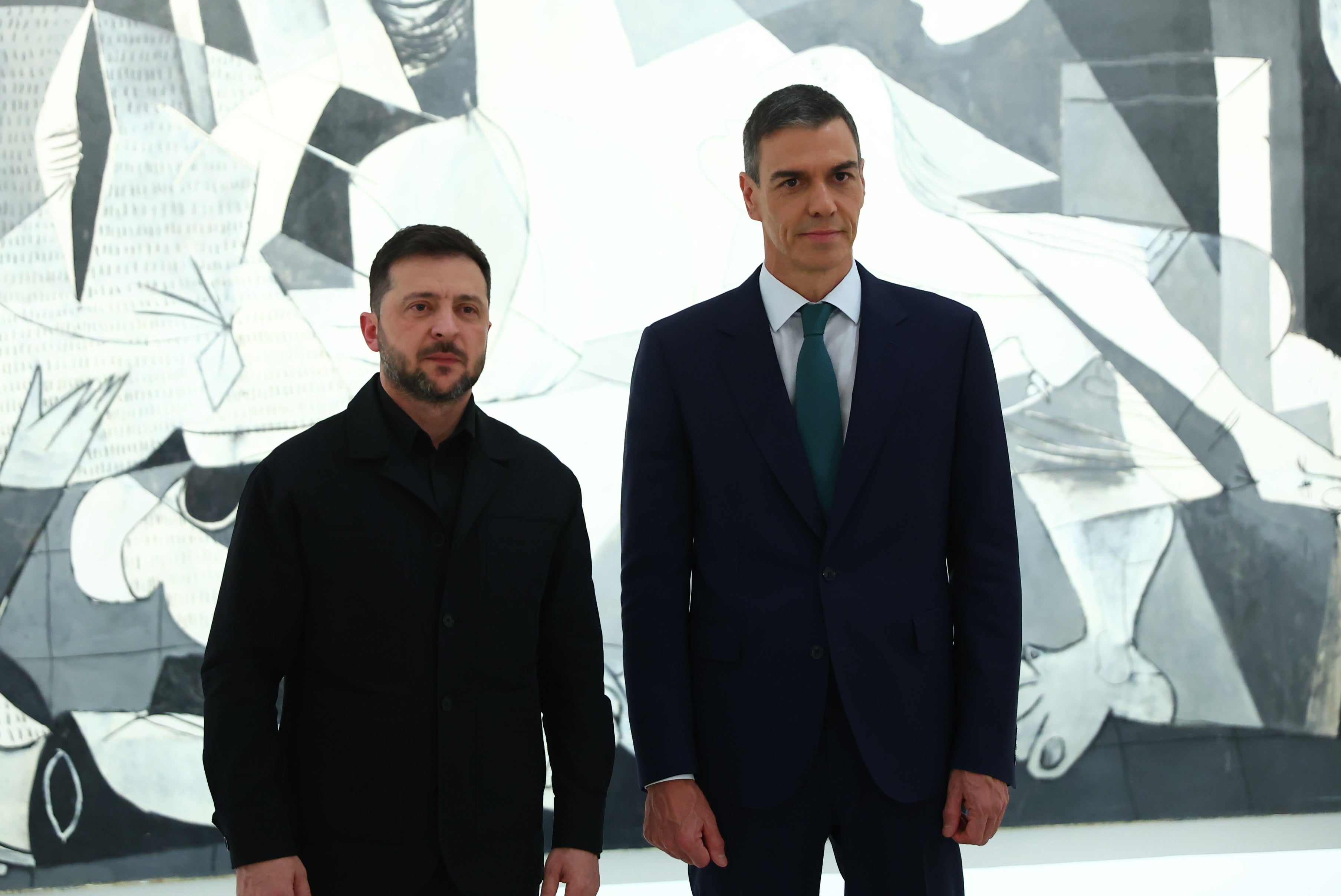 Ukrainian President Volodymyr Zelensky poses with Spain's Prime Minister Pedro Sánchez in front of Pablo Picasso's Guernica