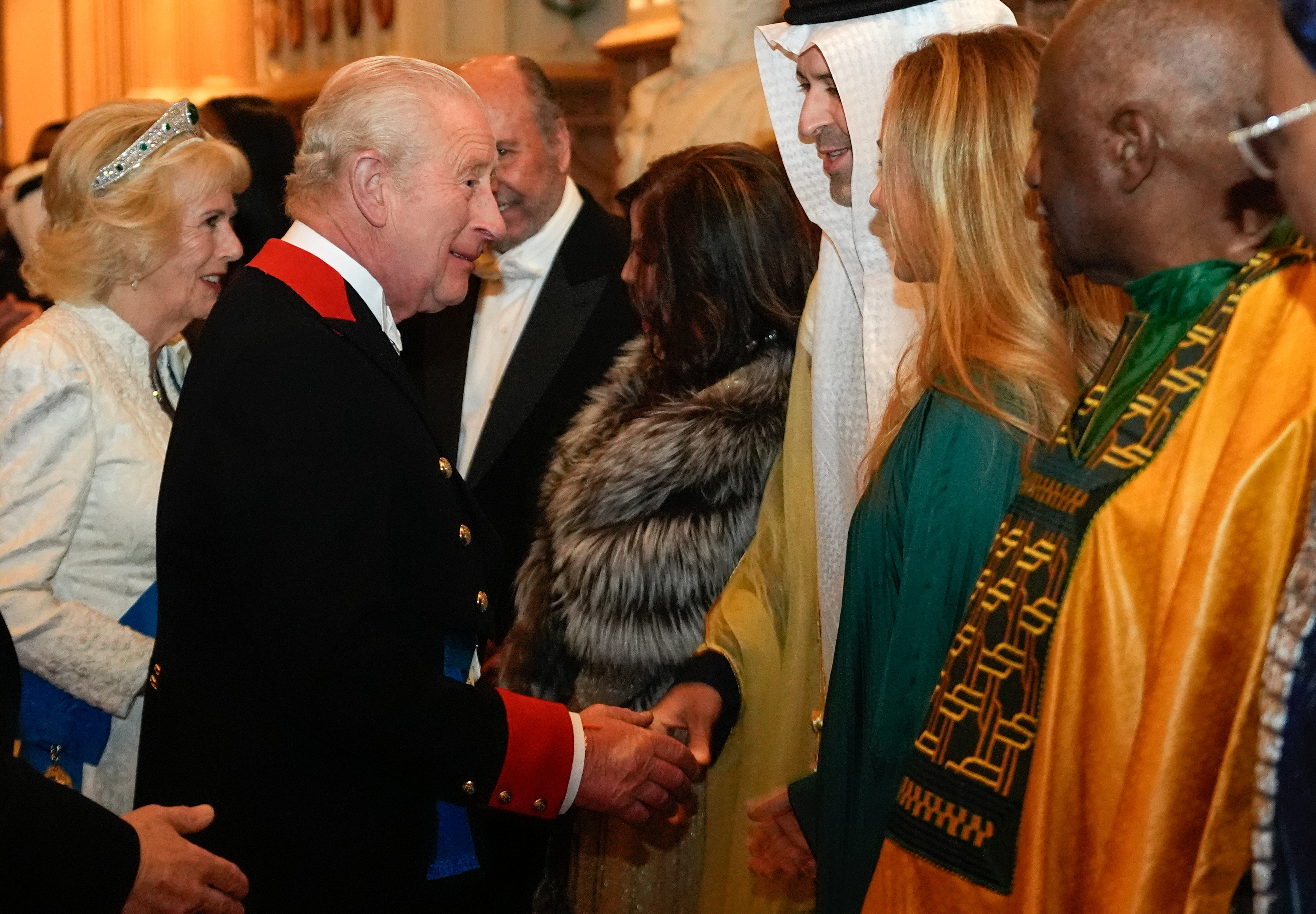 The King and Queen welcoming guests to the castle (Andrew Matthews/PA)