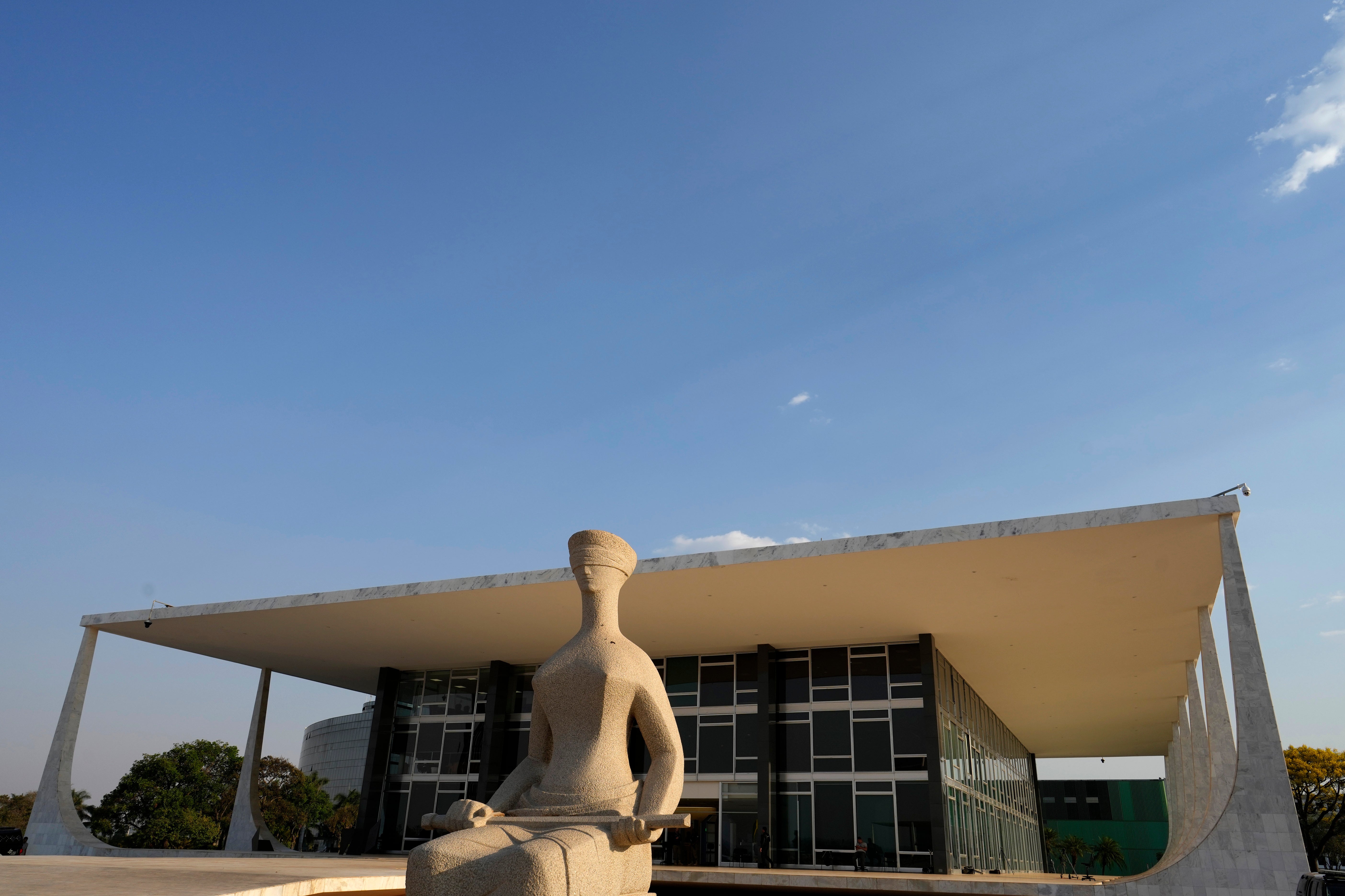 The Statue of Justice stands in front of the Supreme Court in Brasilia, Brazil