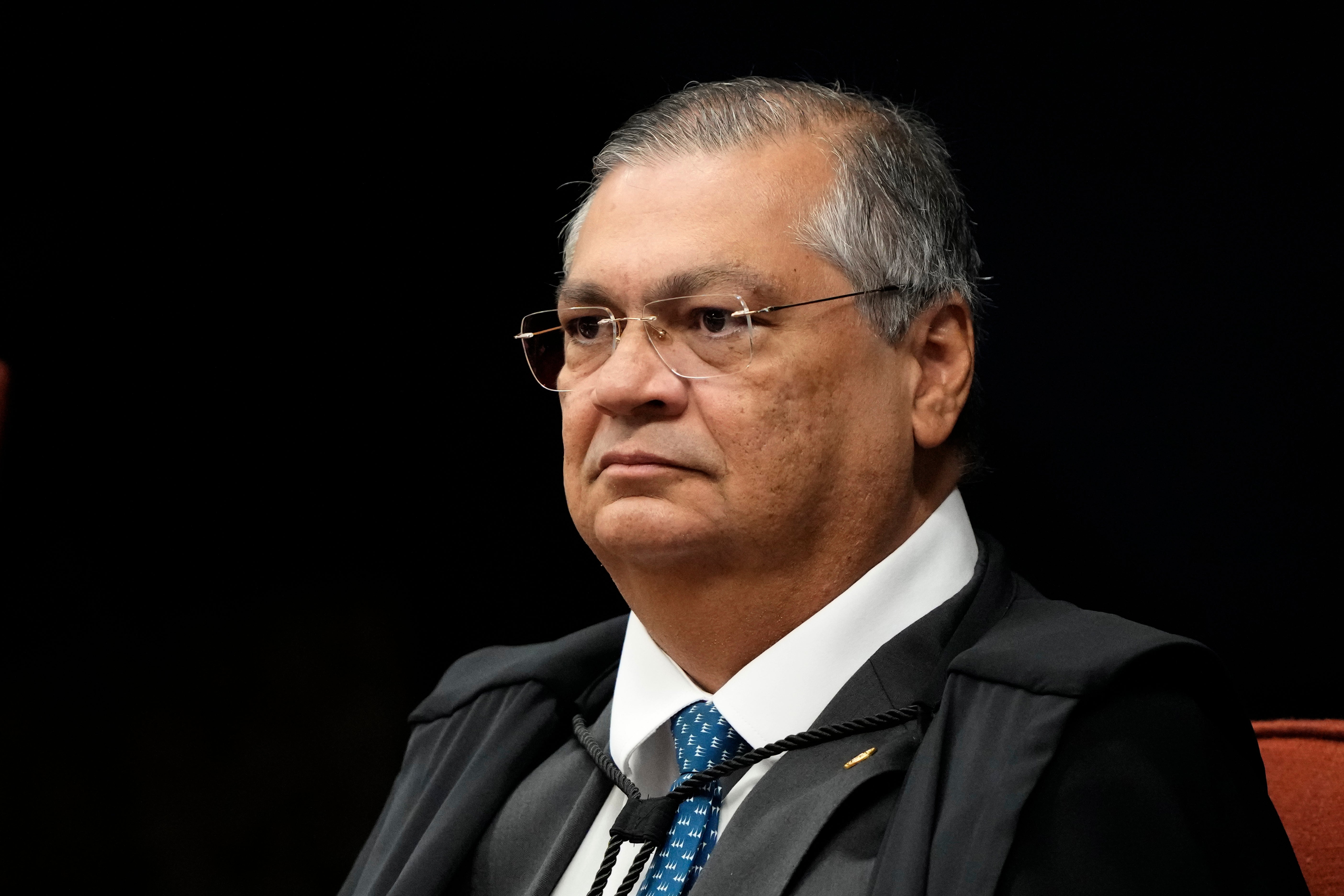Supreme Court Justice Flavio Dino attends the verdict and sentencing phase of a trial for those charged in an alleged coup plot to keep former President Jair Bolsonaro in office after his 2022 election defeat, in Brasilia, Brazil, Sept. 9, 2025. (AP Photo/Eraldo Peres, File)