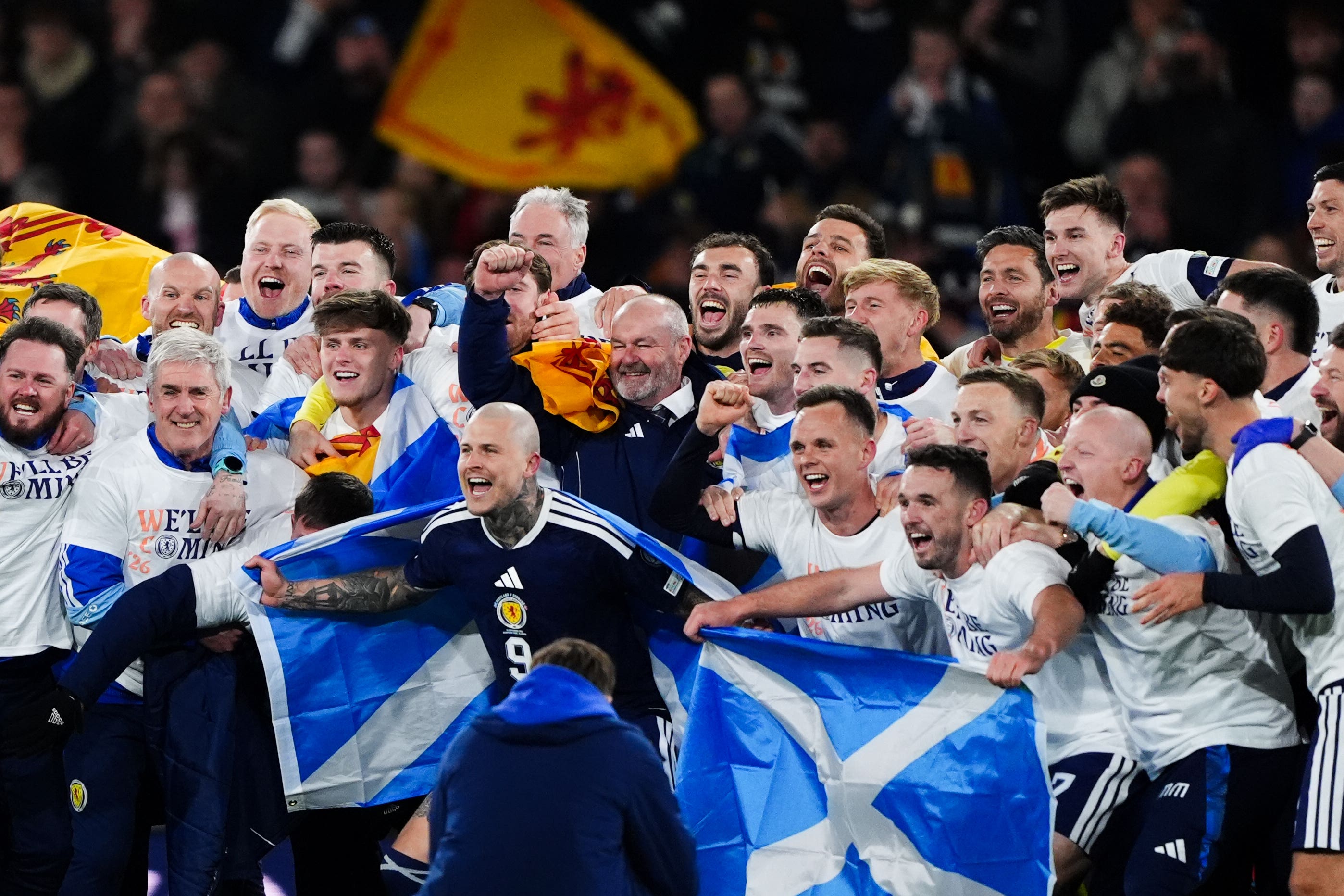 Scotland celebrate after qualifying for the 2026 World Cup (Andrew Milligan/PA)