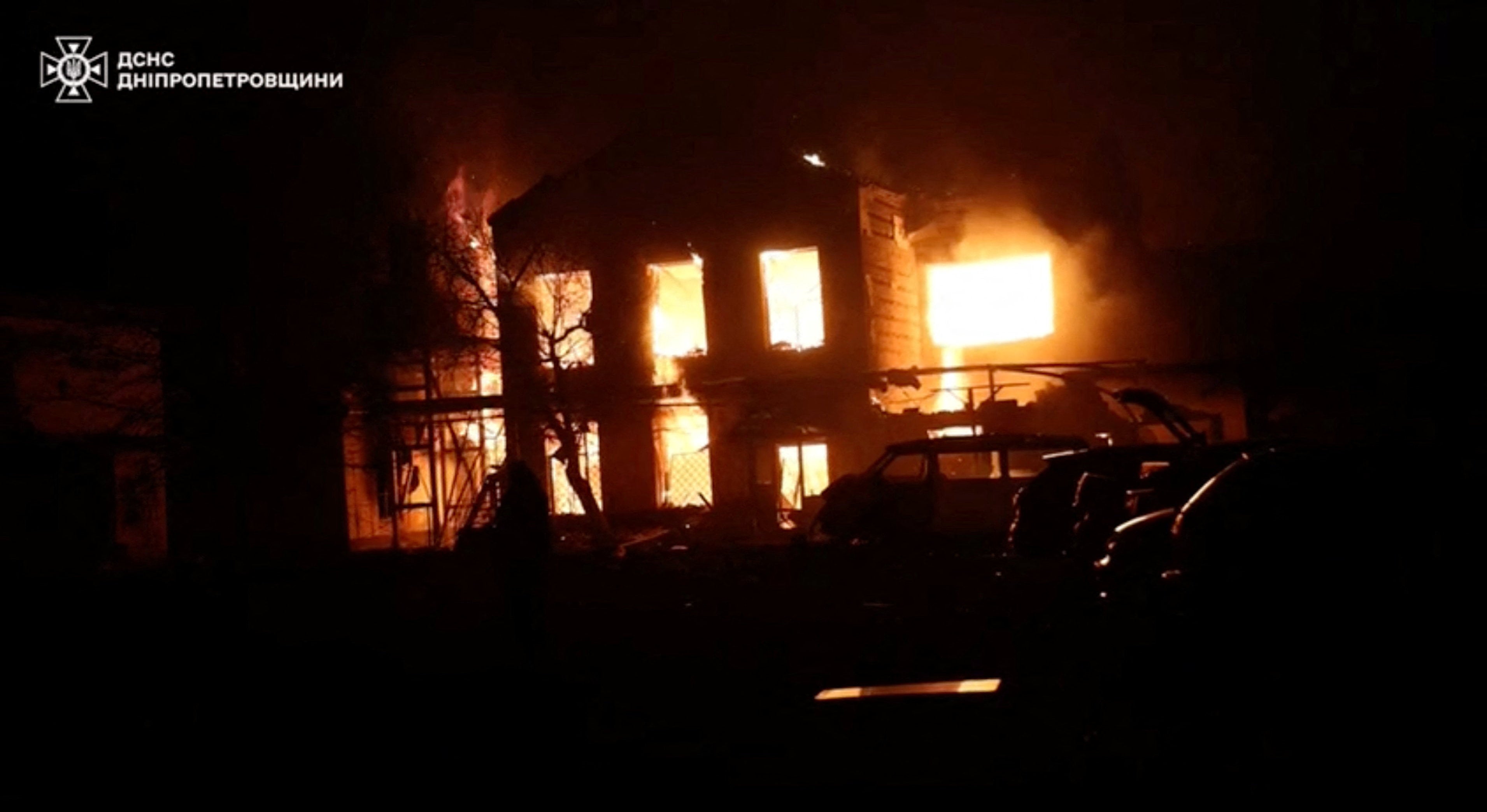 Smoke and flames rise from a building at the site of a Russian drone strike, amid Russia's attack on Ukraine, in a location given as Dnipropetrovsk region, Ukraine