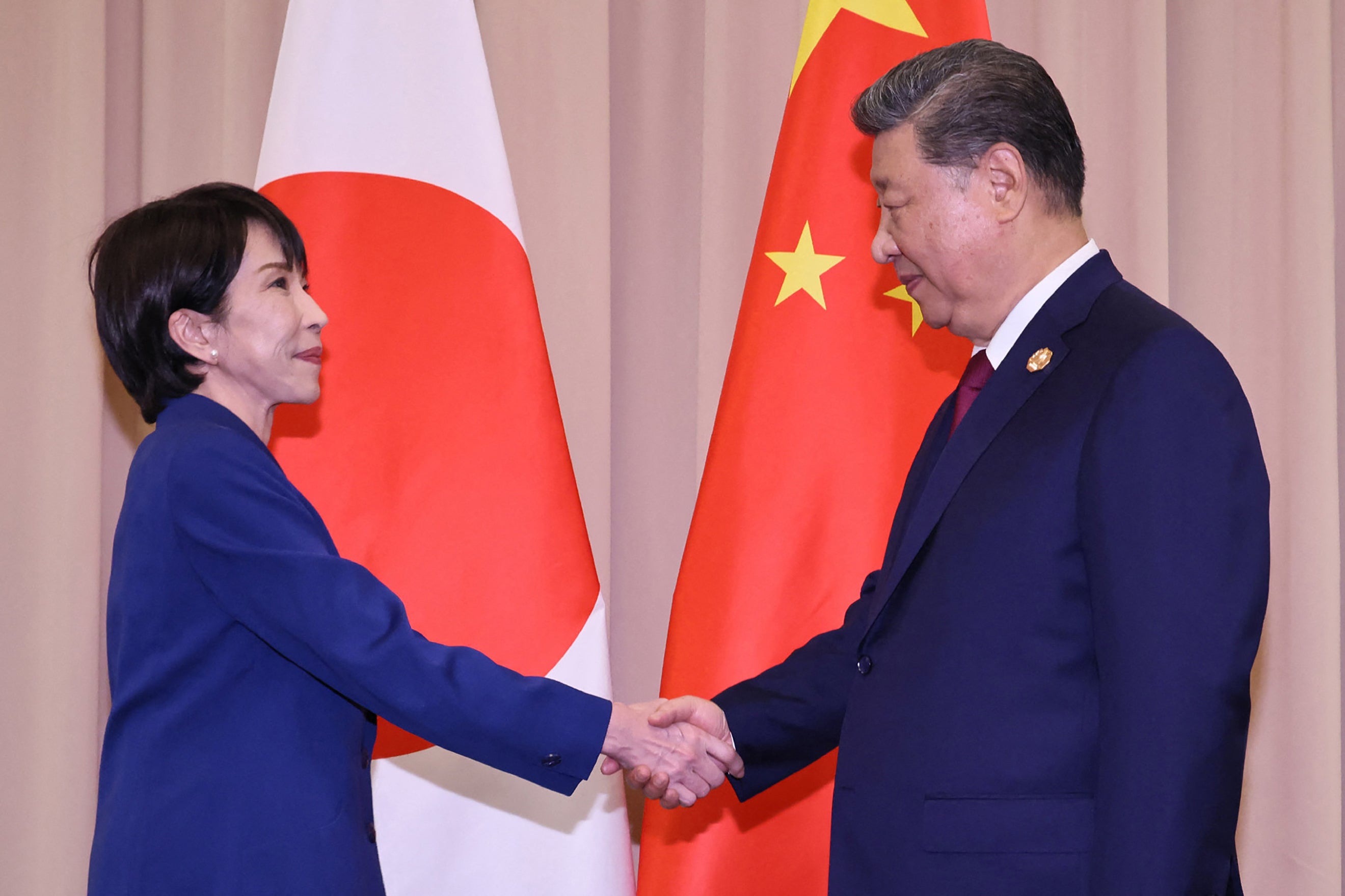 <p>Japan's PM Sanae Takaichi shakes hands with Chinese president Xi Jinping ahead of the Japan-China summit on the sidelines of the Asia-Pacific Economic Cooperation (APEC) Summit in Gyeongju</p>