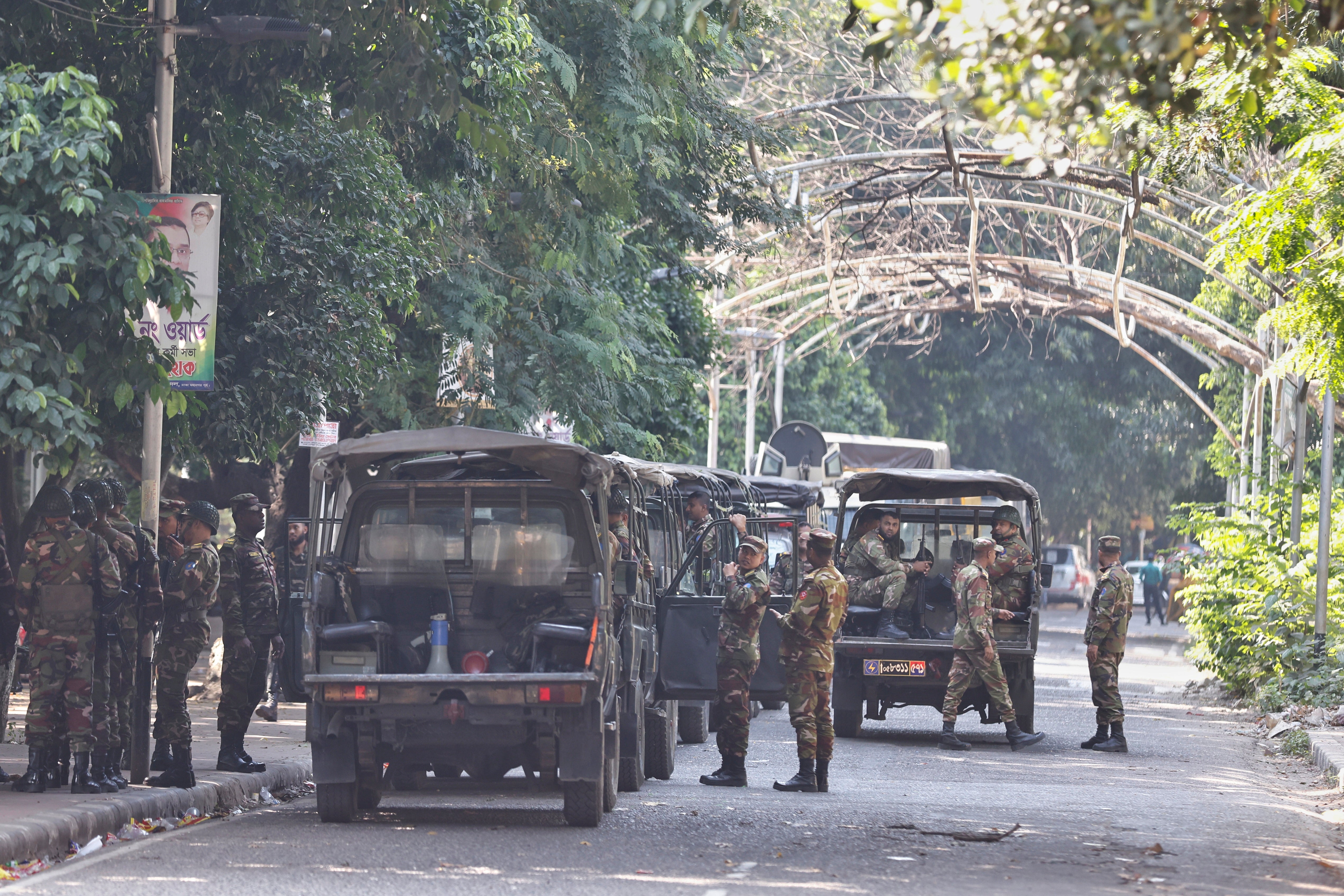 Soldiers stand outside the demolished home of Sheikh Hasina’s father and Bangladesh’s founder Sheikh Mujibur Rahman