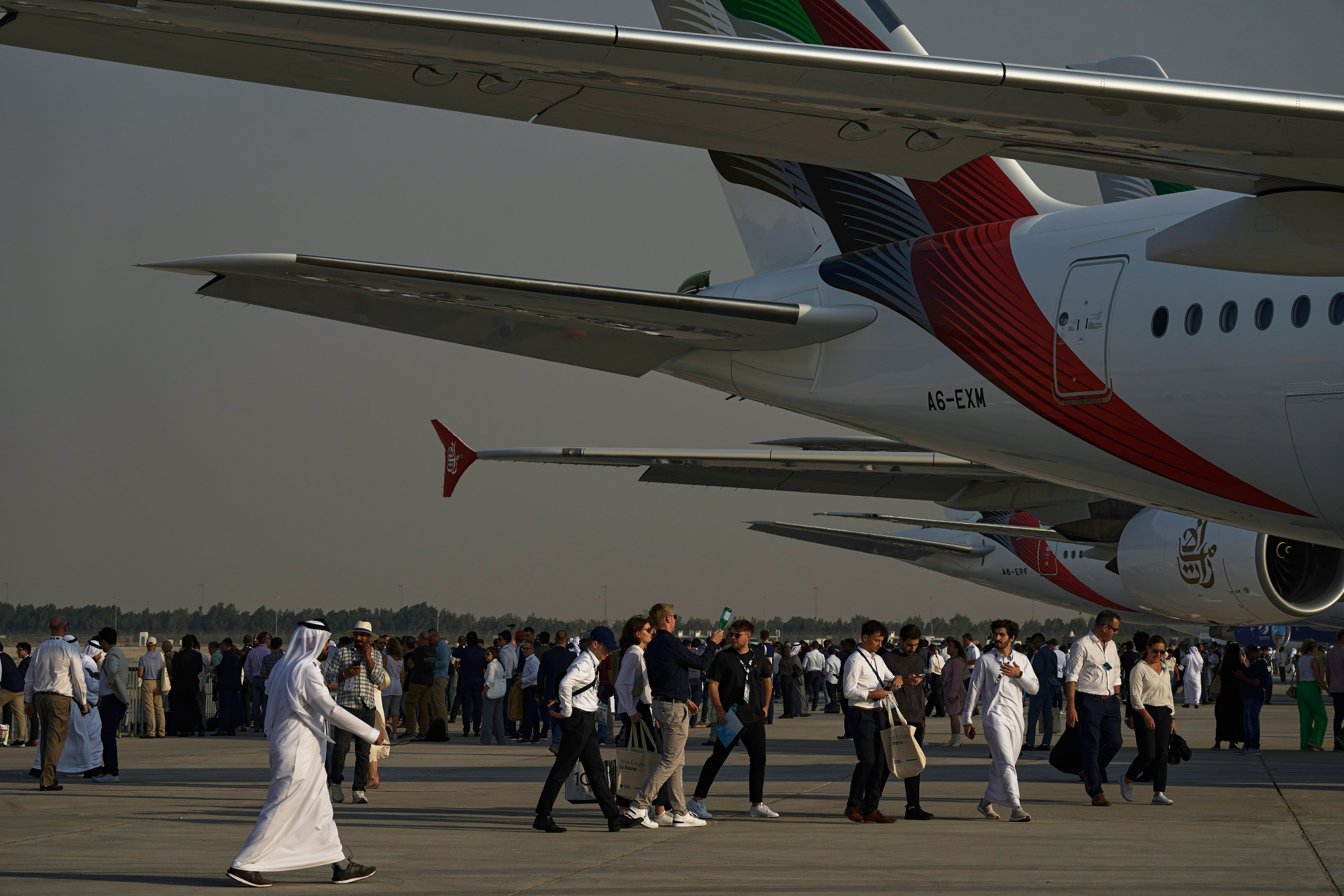 Emirates Dubai Air ShowPeople walk at the Dubai Air Show in Dubai, United Arab Emirates, Tuesday, Nov. 18, 2025. (AP Photo/Fatima Shbair)