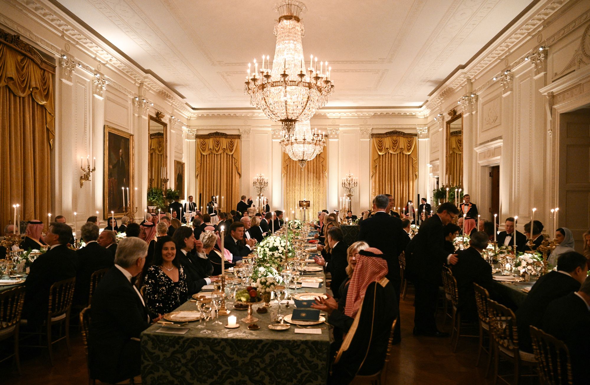 Elegant piano music played as prominent guests gathered in the candlelit East Room of the White House