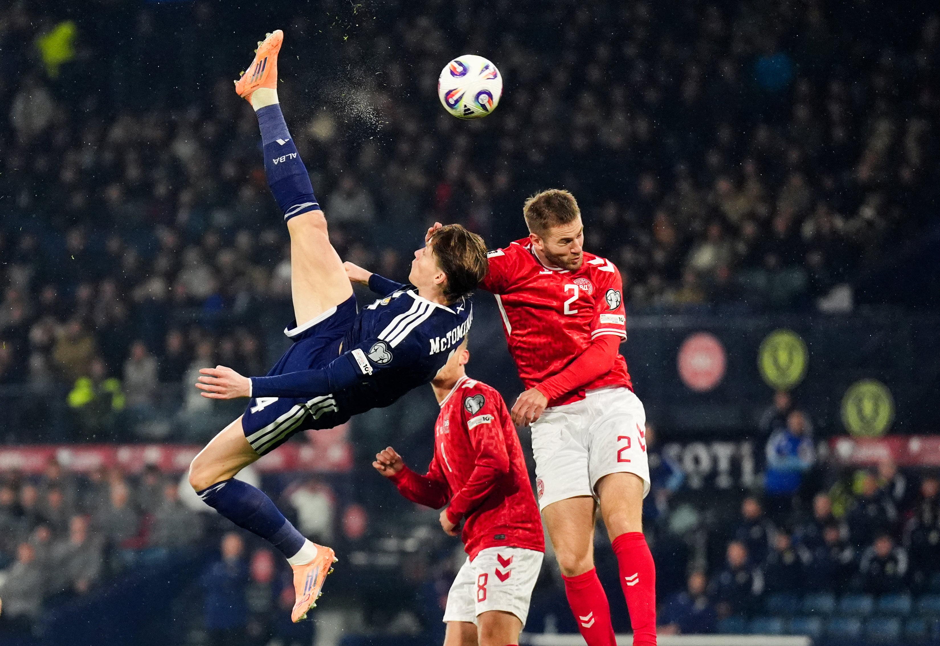 <p>Scotland’s Scott McTominay scores the opening goal during the win over Denmark (Andrew Milligan/PA)</p>