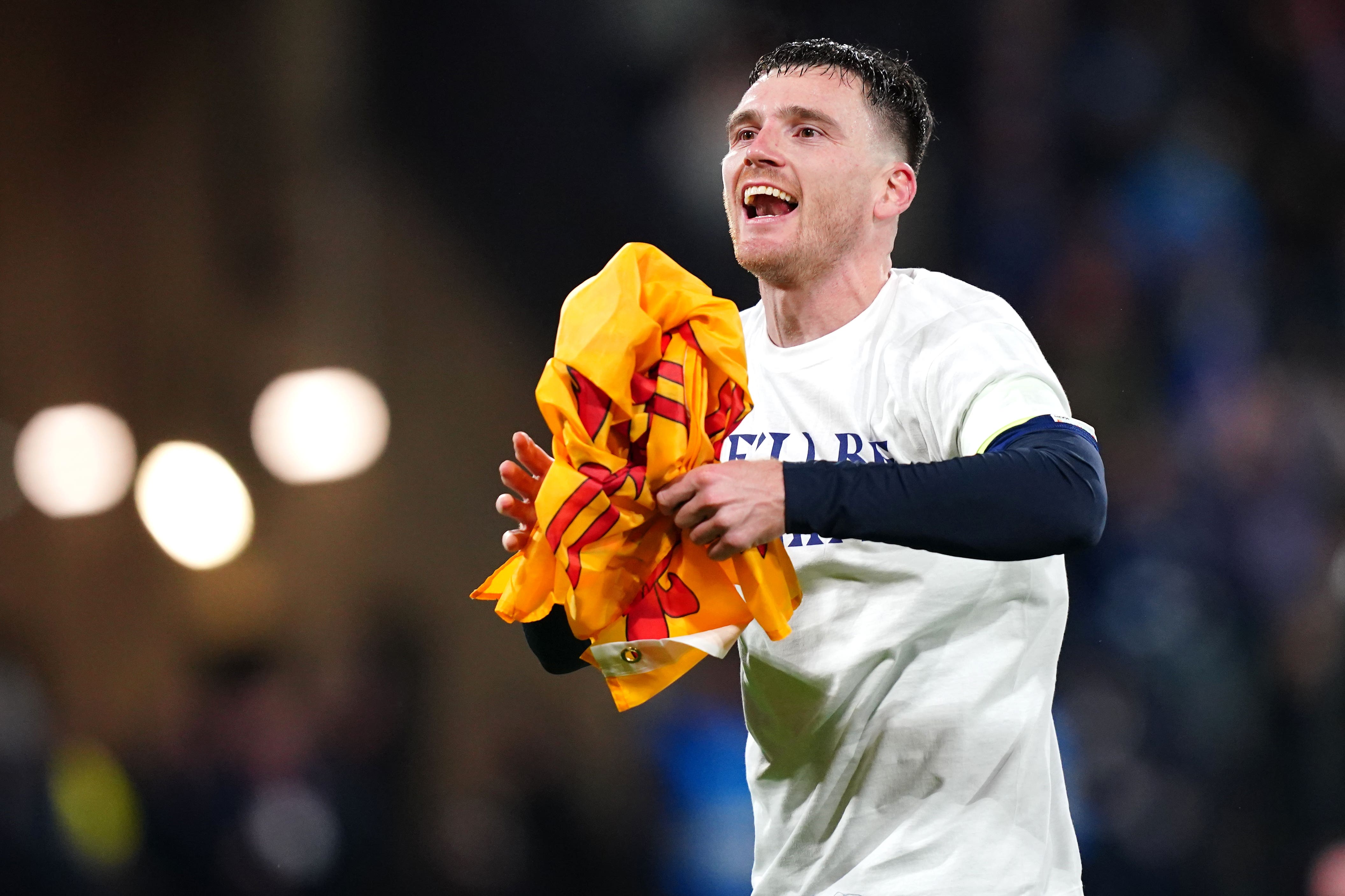 Andy Robertson celebrates after leading Scotland to the World Cup (Jane Barlow/PA)