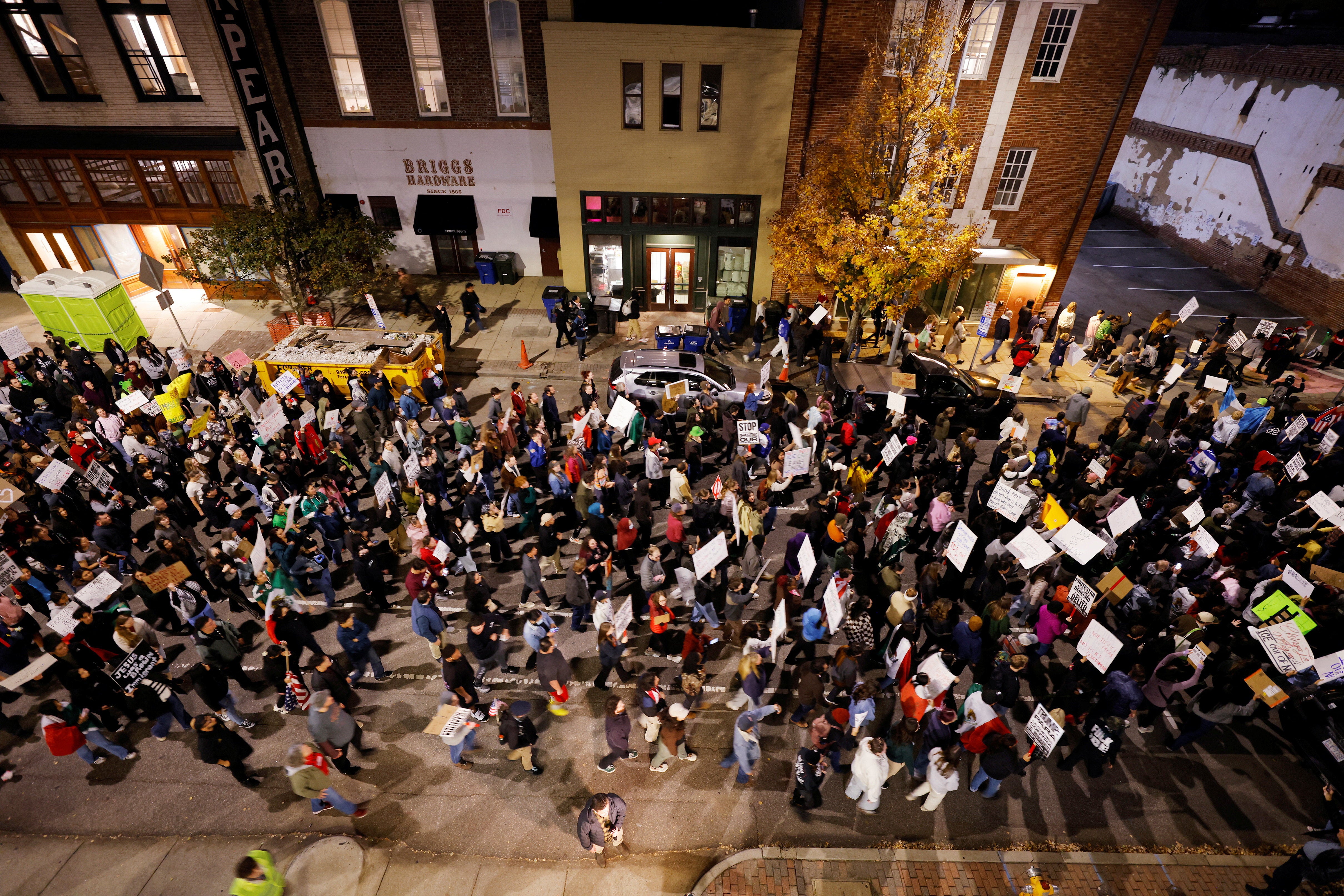 Hundreds of demonstrators march in protest of federal authorities as they expand their immigration operations after arresting 130 people over the weekend in Charlotte