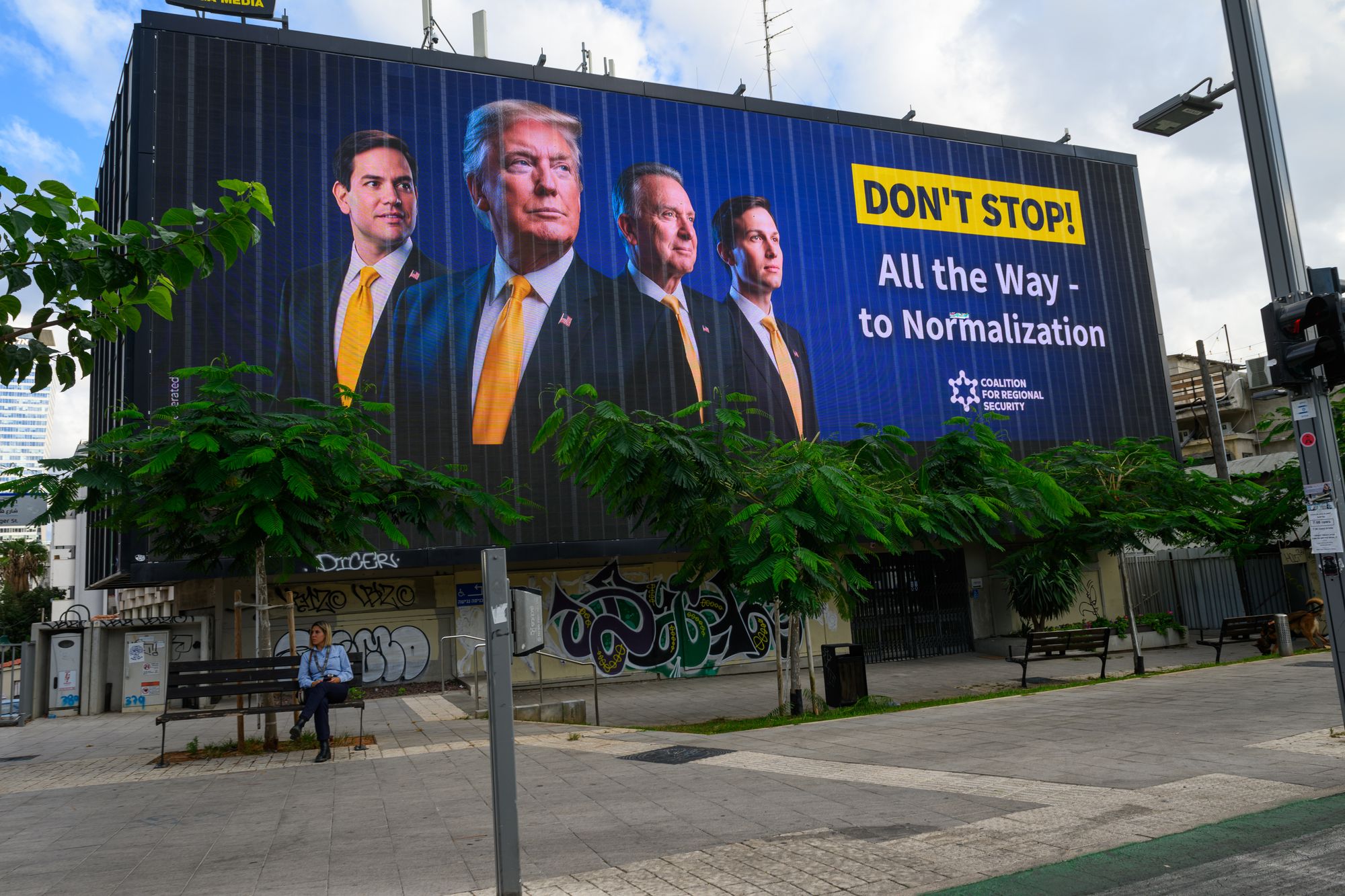 A billboard displays the words, ‘Don’t stop all the way to normalization’, with pictures of Trump, Witkoff, Kushner and Marco Rubio, the secretary of state, on 12 October 2025 in Tel Aviv, Israel