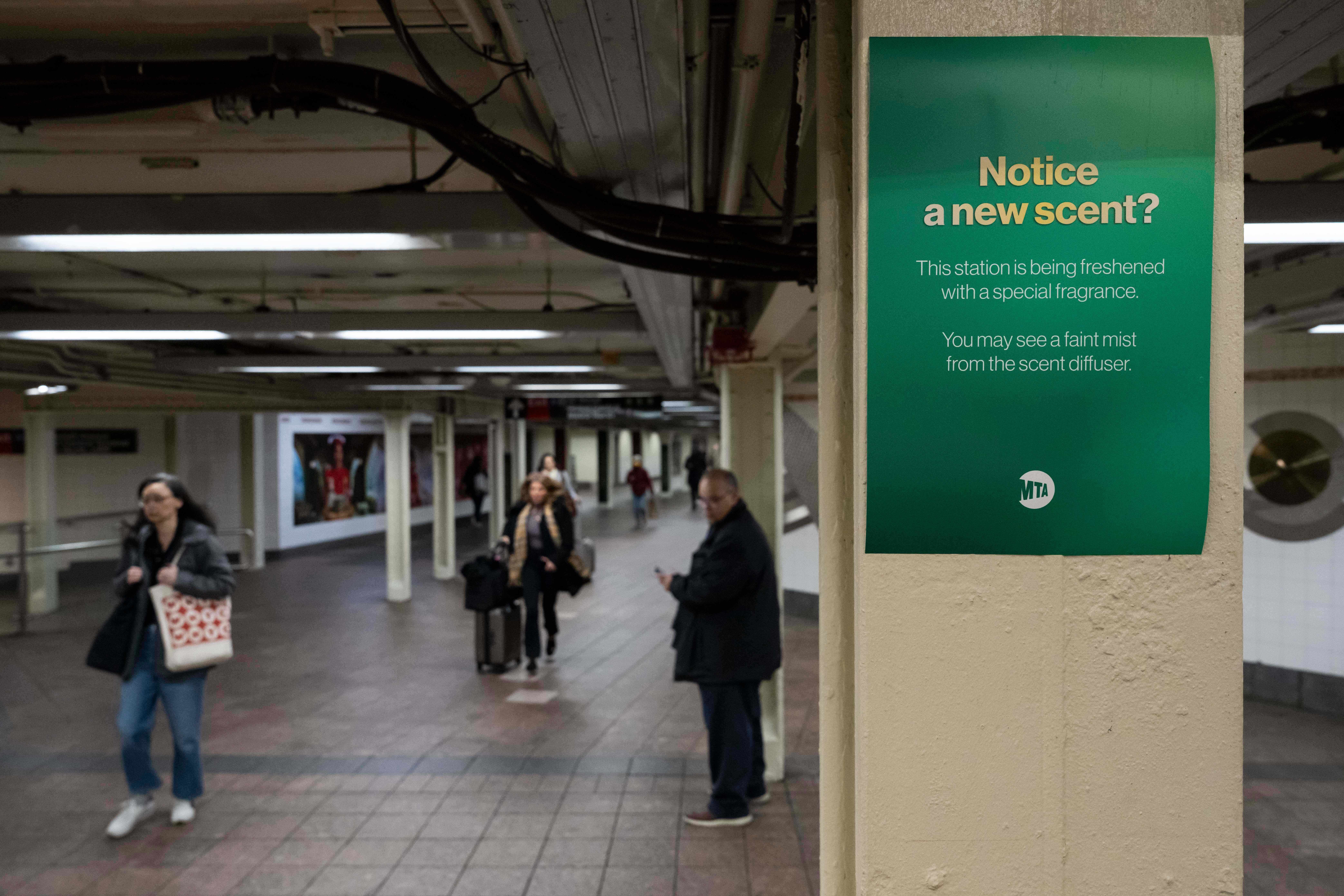 A poster reading ‘Notice a new scent?’ Is displayed at Grand Central Terminal, Wednesday, Nov. 19, 2025, in New York. (AP Photo/Yuki Iwamura)