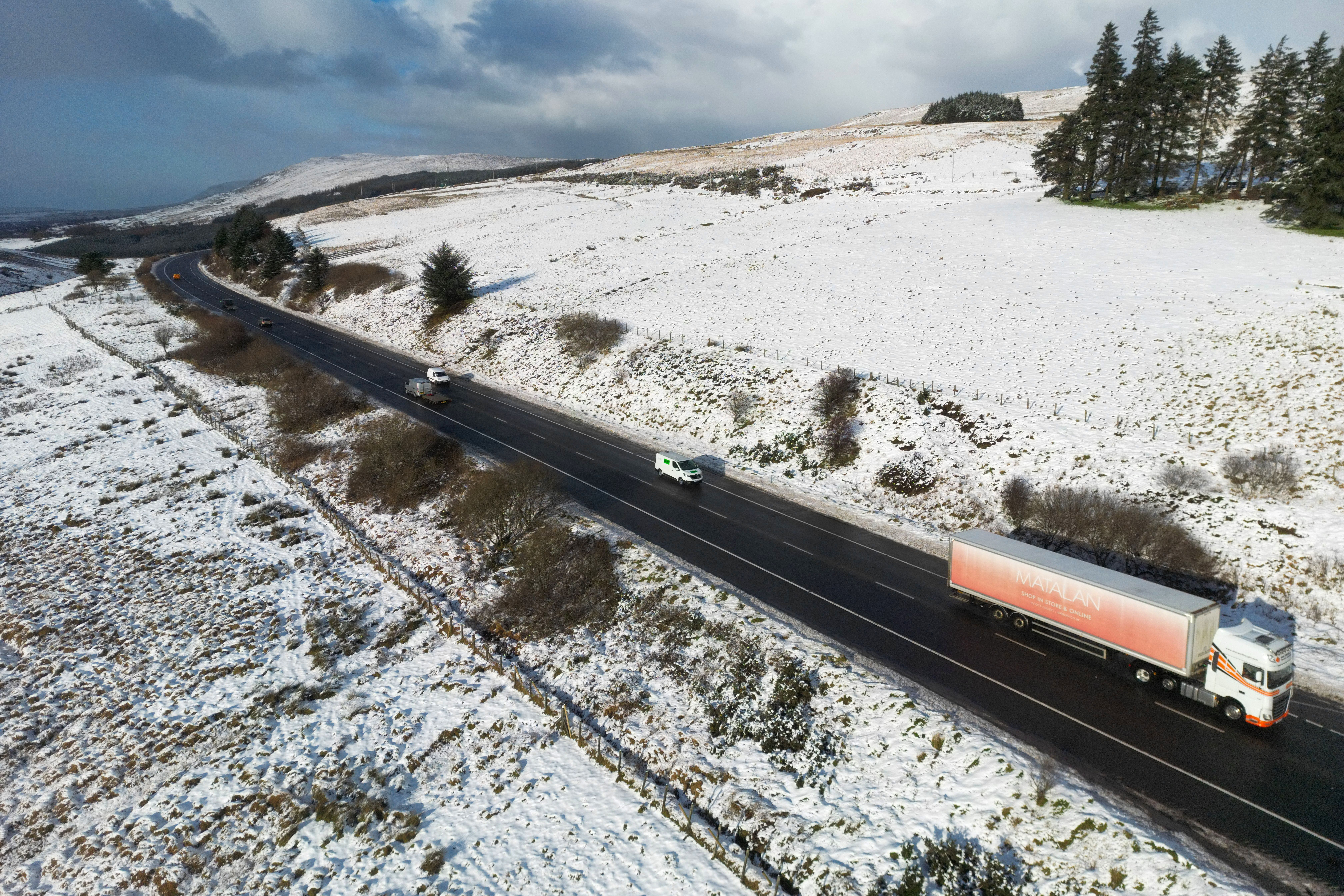 People drive their vehicles along the Glenshane Pass cutting through the Sperrin Mountains in Co Londonderry (Liam McBurney/PA)