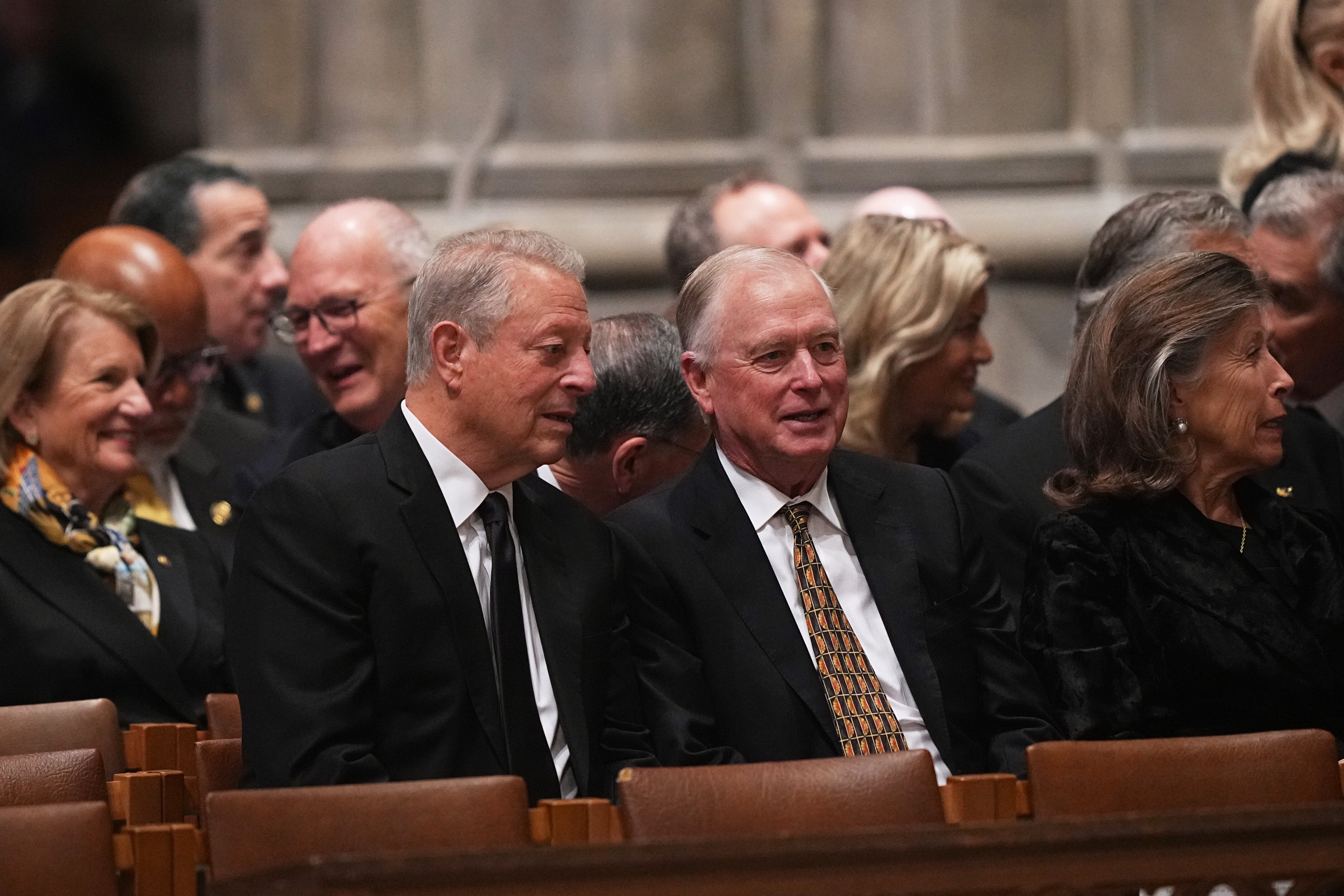 Two former vice presidents – Democrat Al Gore, left, and Republican Dan Quayle – speaking ahead of the service