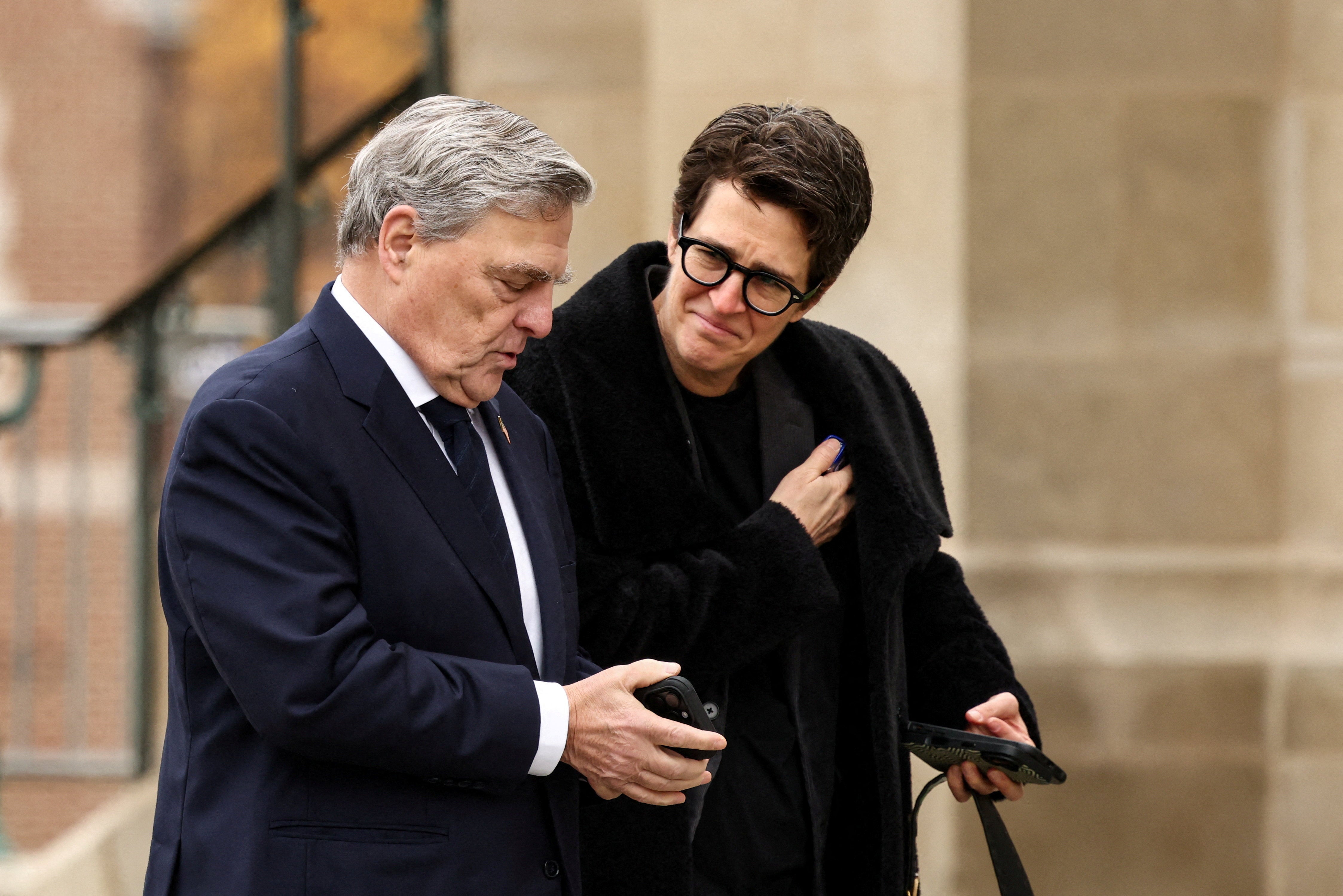 Former Chairman of the Joint Chiefs of Staff Mark Milley walks with MS NOW host Rachel Maddow