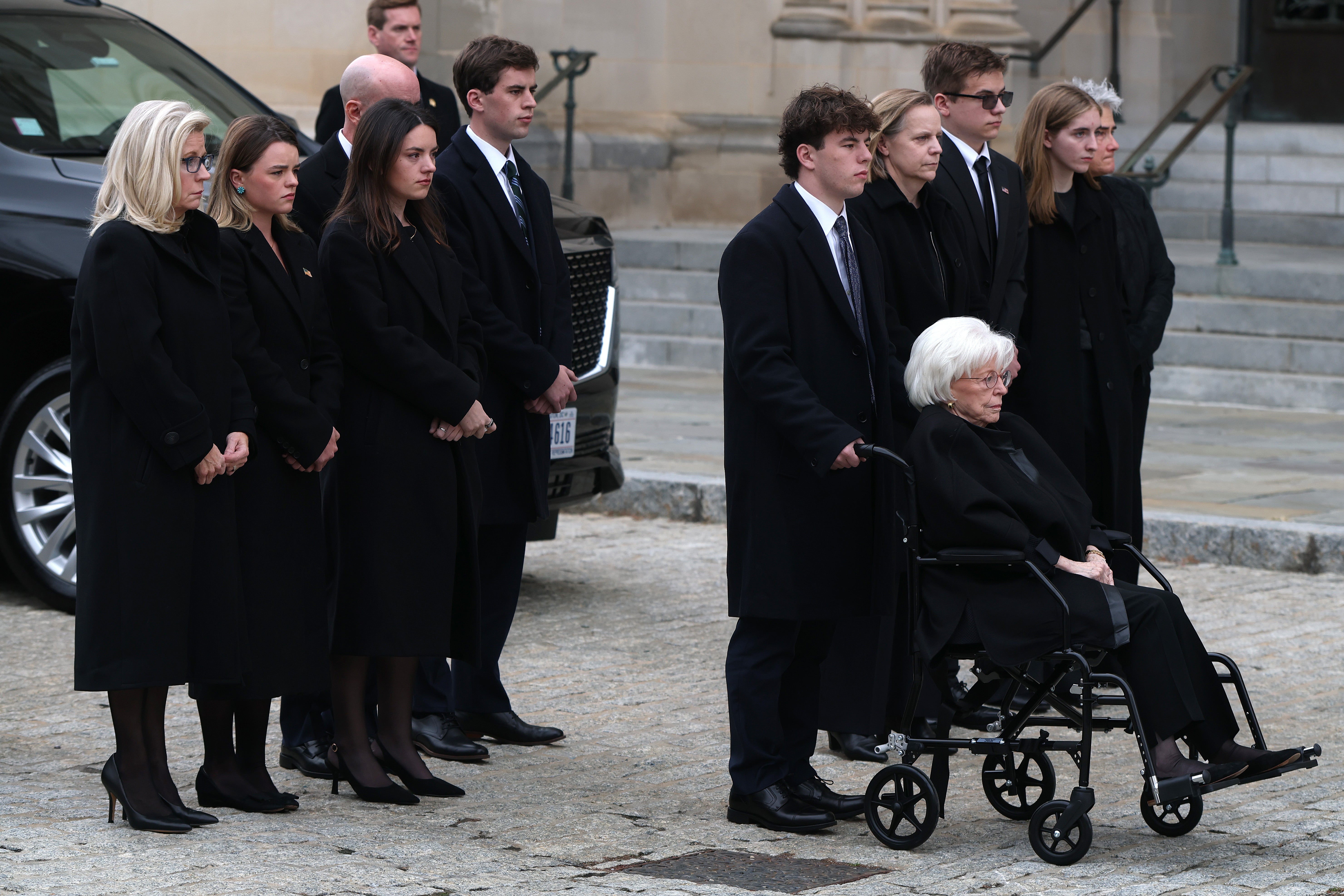 Lynne Cheney, right, Dick Cheney’s widow, former Rep. Liz Cheney, left, and other family members arrive at the National Cathedral