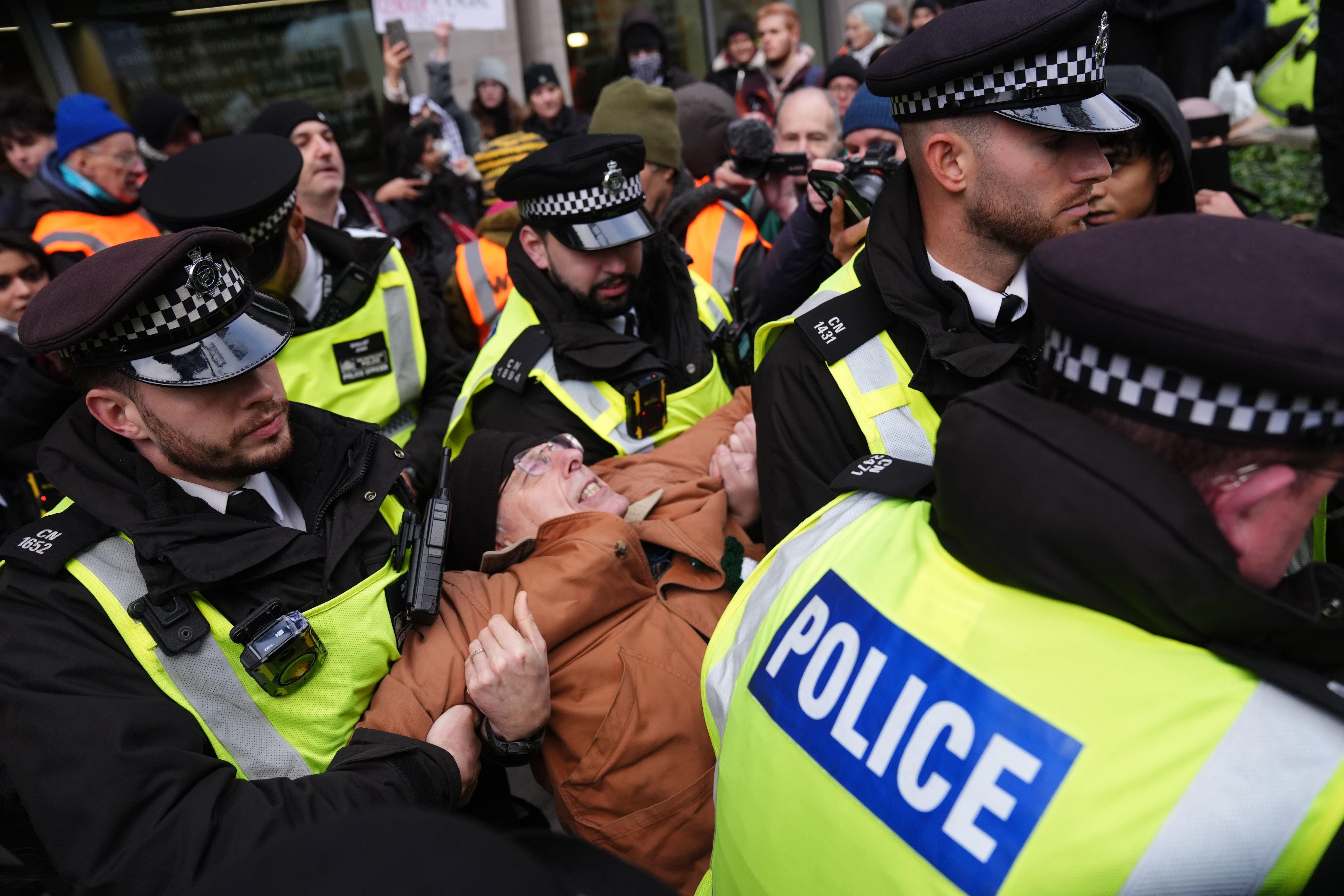 A person was seen being carried away by police (Ben Whitley/PA)