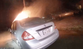 Police smash their way into burning car and drag out driver