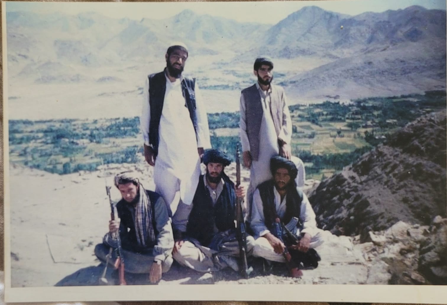 Maiwand Banayee, sitting on the far right, with fellow Taliban fighters in Maidan-Shar, Afghanistan