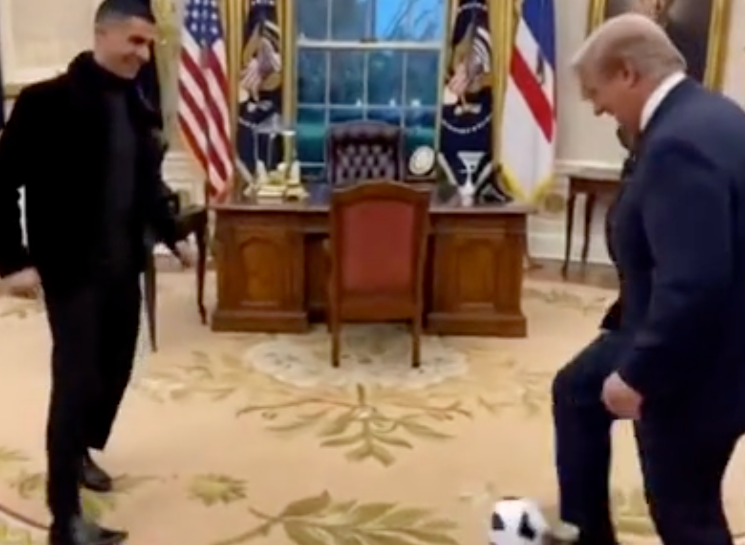 Donald Trump has shared a bizarre AI-generated video of himself playing football with Cristiano Ronaldo