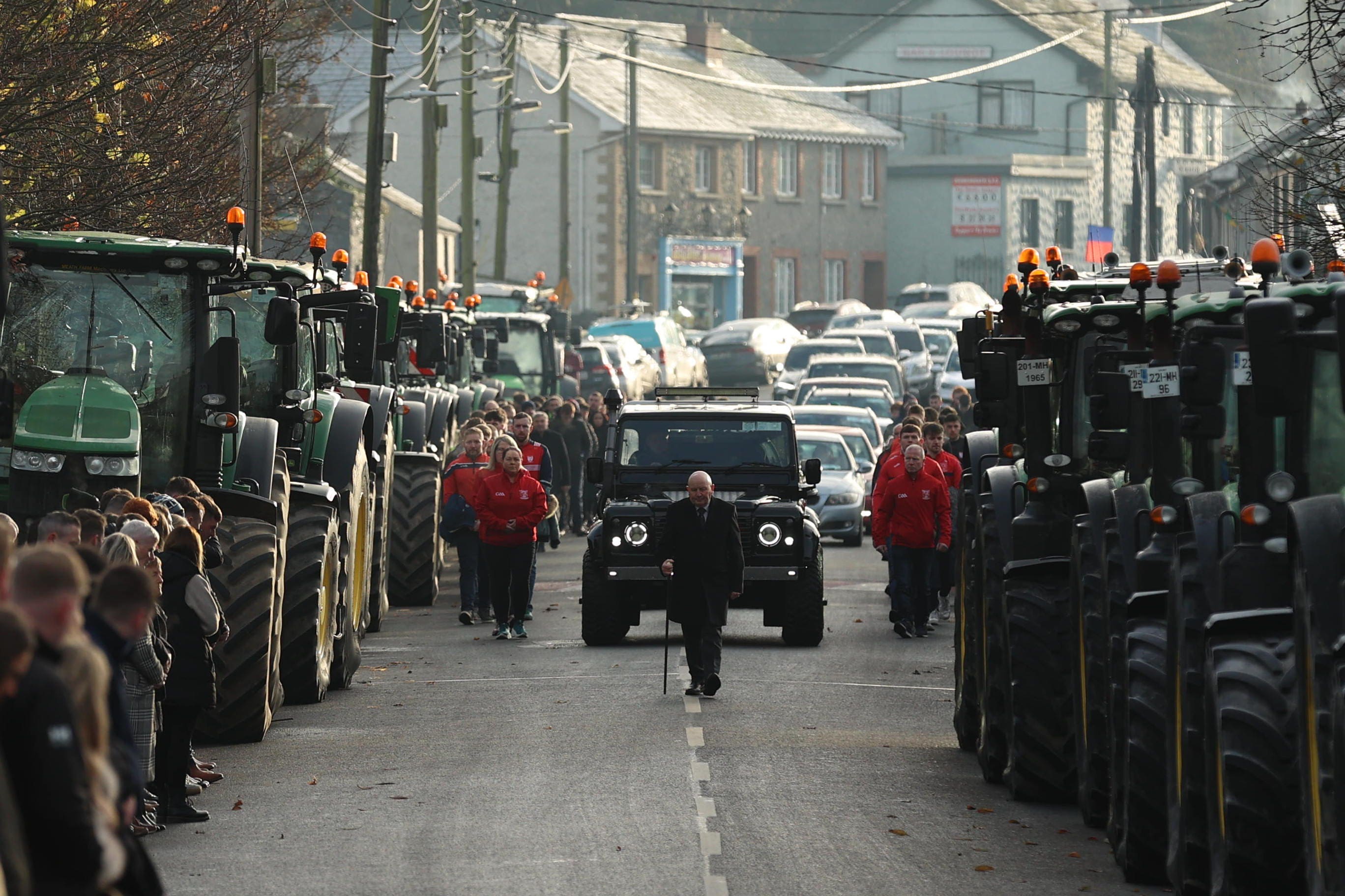 Members of Drumconrath GFC walked alongside the funeral cortege for Alan McCluskey at Peter and Paul’s Church, Drumconrath (PA)