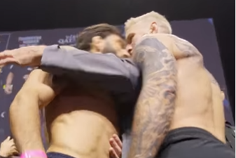 Arman Tsarukyan (left) headbutts Dan Hooker at the weigh-ins for UFC Qatar
