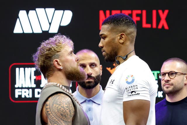 <p>Jake Paul (left) staring up at Anthony Joshua ahead of their fight in Miami next month</p>