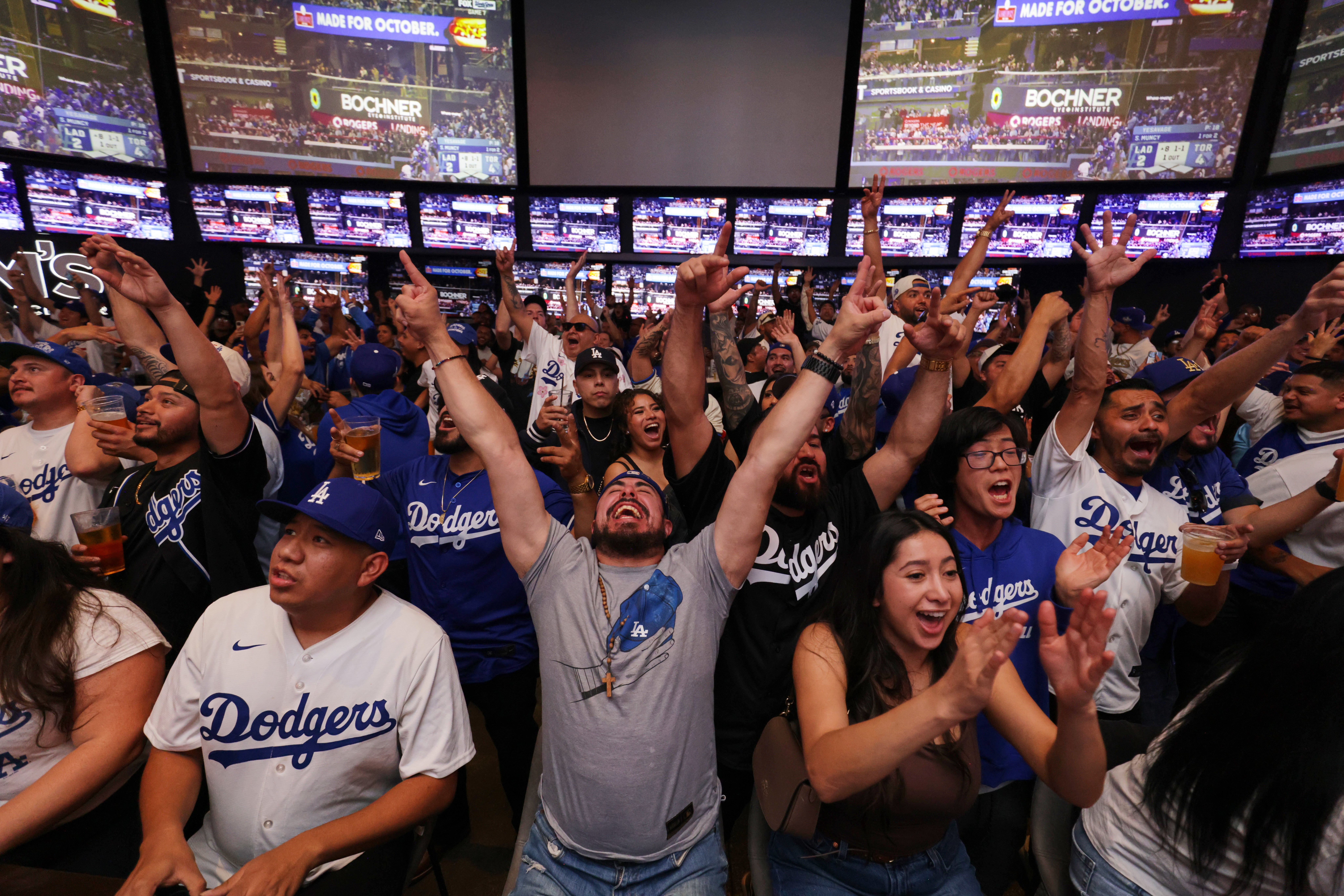 <p>Fans react as the Los Angeles Dodgers play the Toronto Blue Jays in Game 7 of baseball's World Series at a watch party on Saturday, Nov. 1, 2025, in Los Angeles. (AP Photo/Ethan Swope, File)</p>