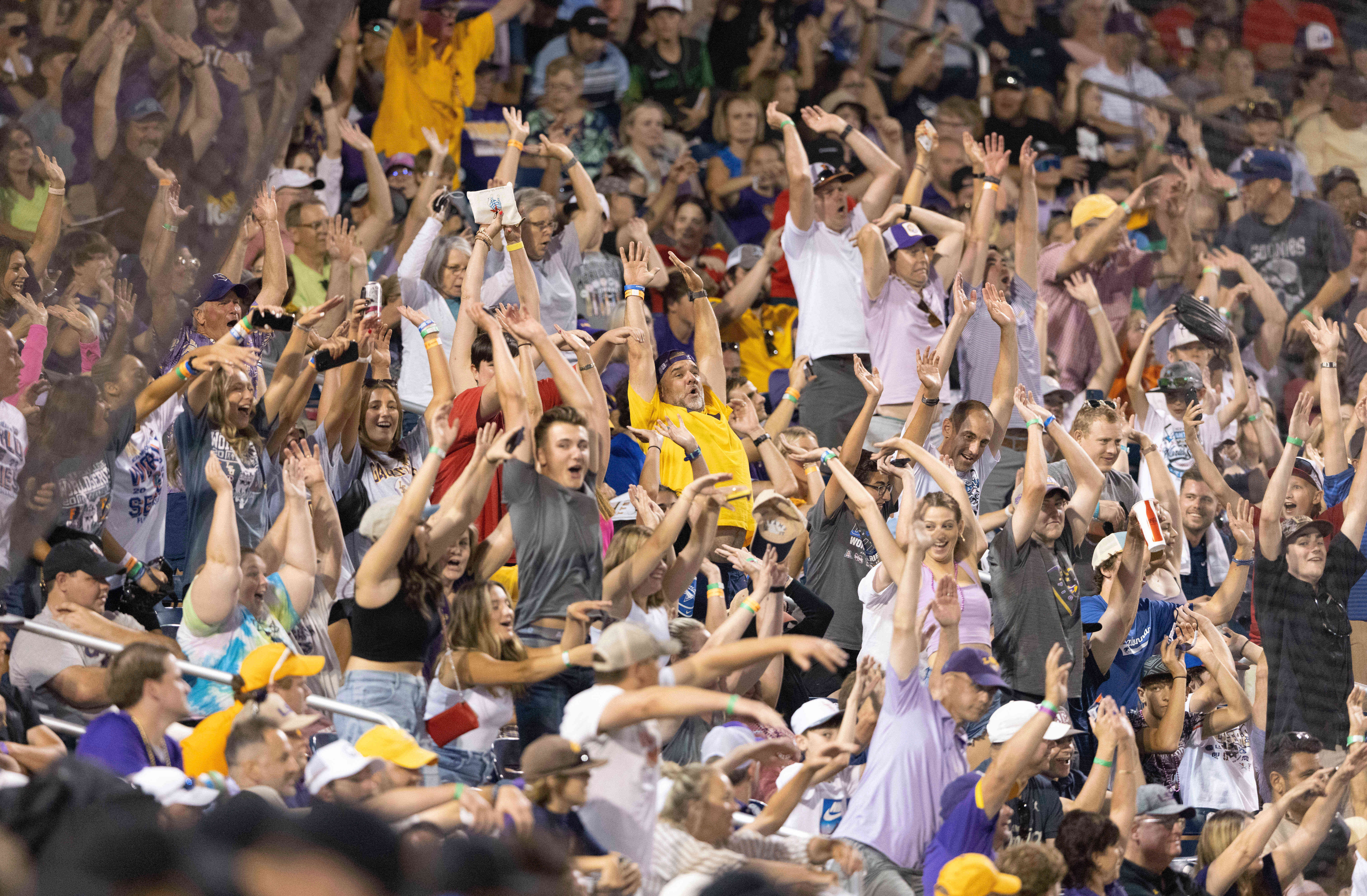 Fans do the wave as Tennessee plays against LSU in the eighth inning of a baseball game at the NCAA College World Series in Omaha, Neb., June 17, 2023. (AP Photo/Rebecca S. Gratz, File)