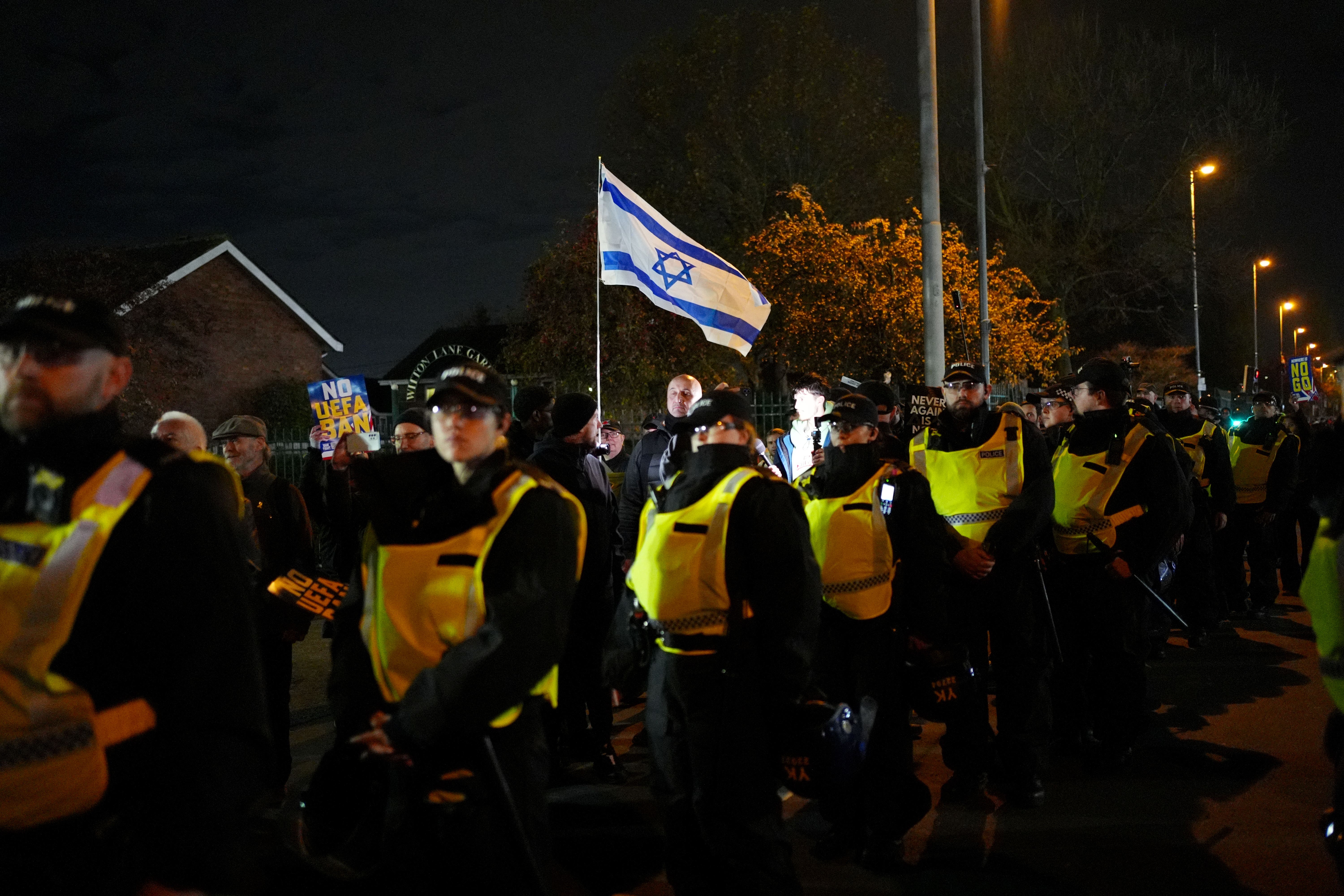 Pro-Israel supporters are led away from Villa Park, home of Aston Villa, by police officers before the match last month