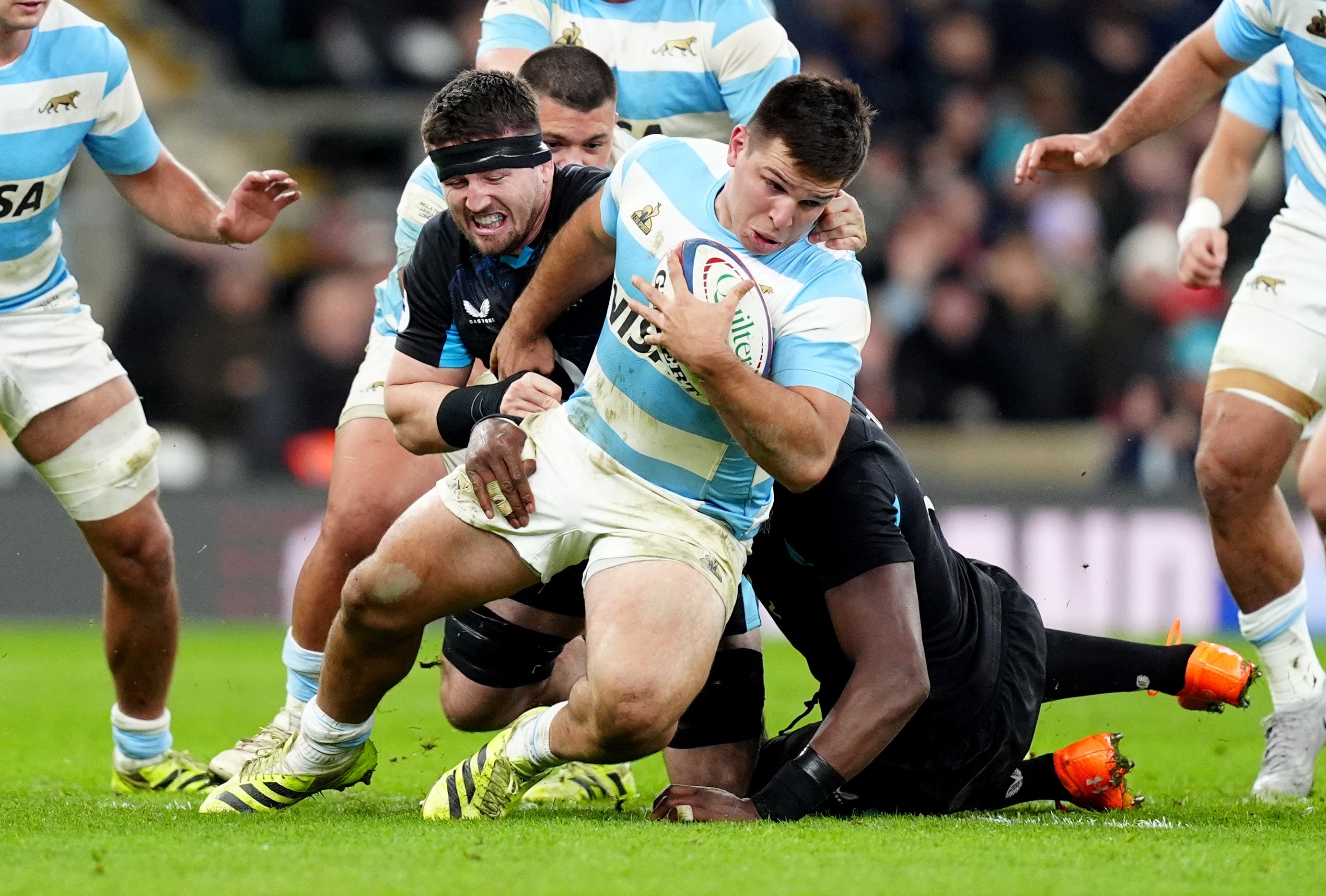 Argentina’s Justo Piccardo (centre) is tackled by England’s Tom Curry (left) (David Davies/PA)