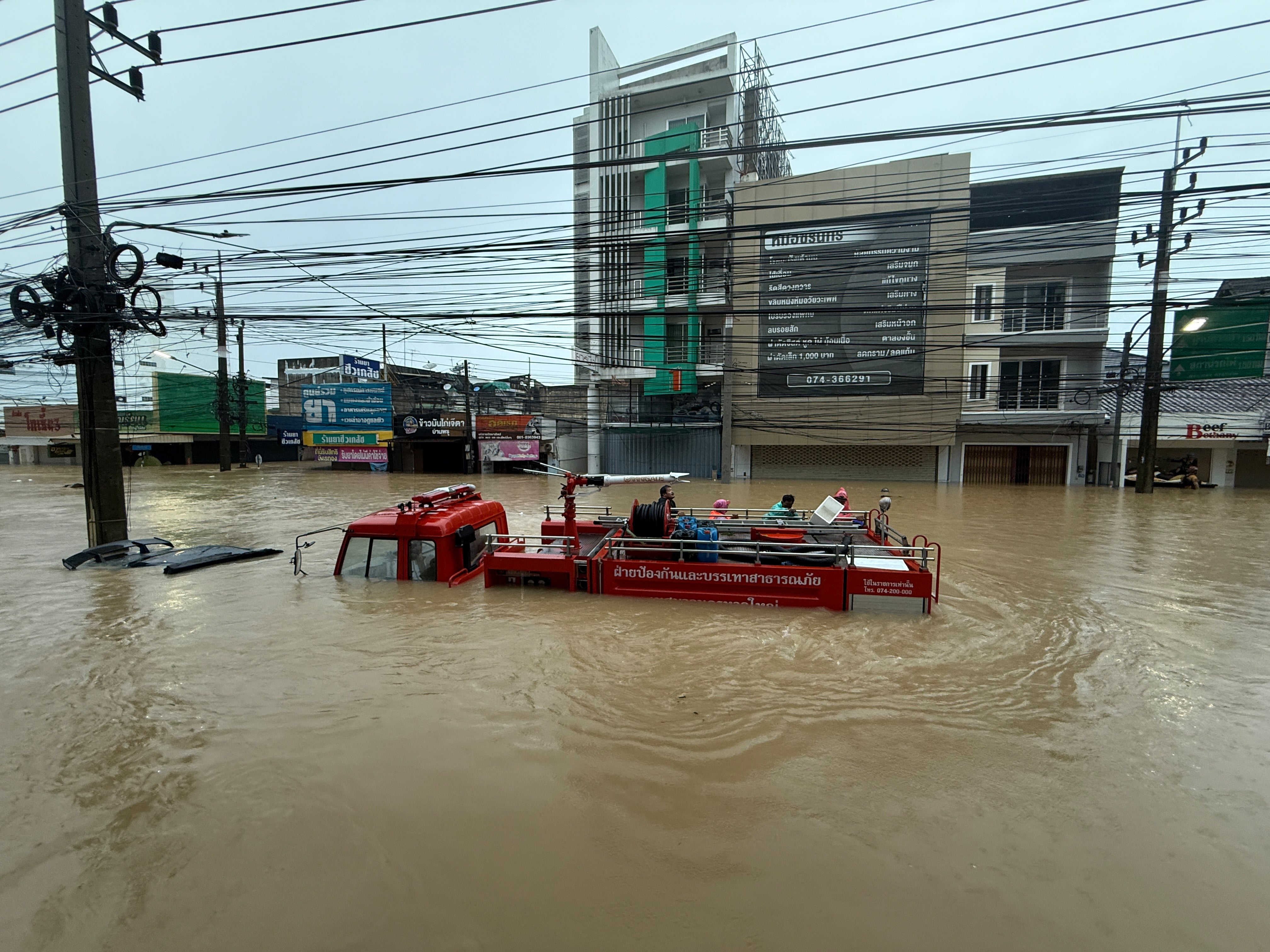 A fire truck is submerged in floodwaters in Songkhla province, southern Thailand,