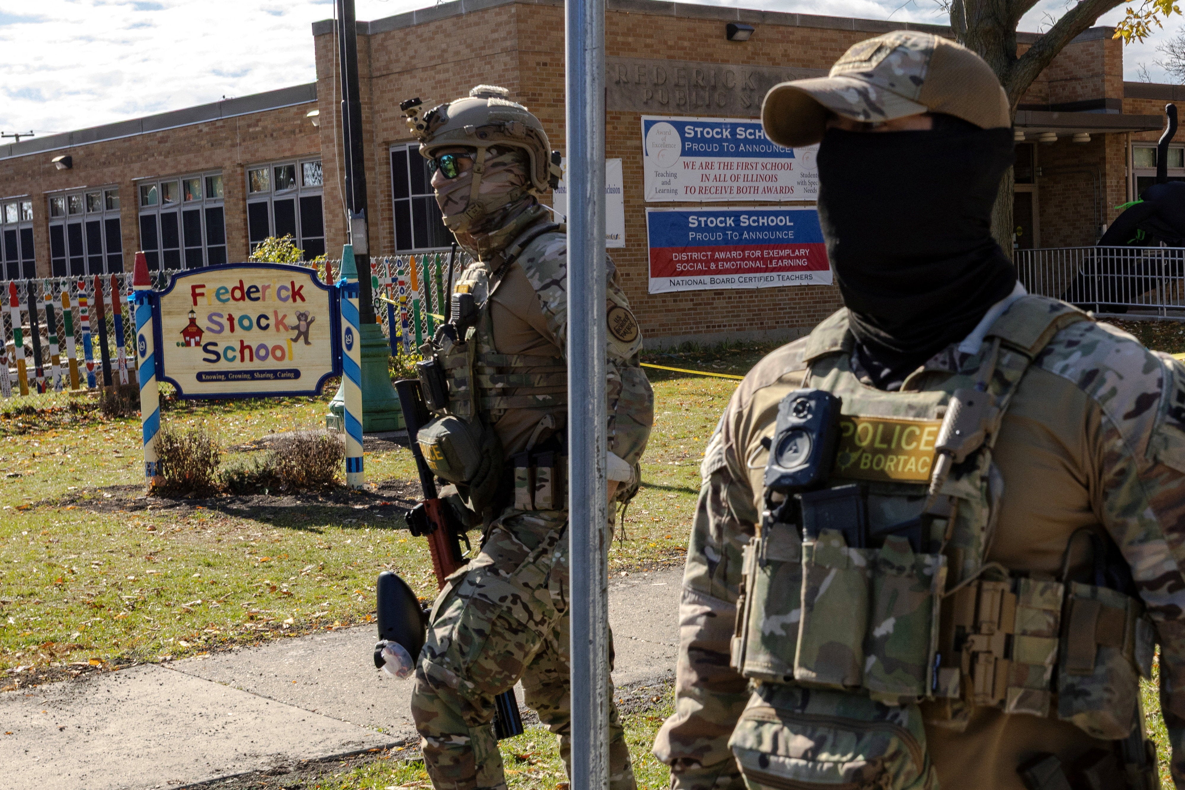 The Trump administration’s surge of federal agents, pictured outside a school in Chicago, has prompted campus lockdowns and alarm among students and families who fear arrest and other disruptions.