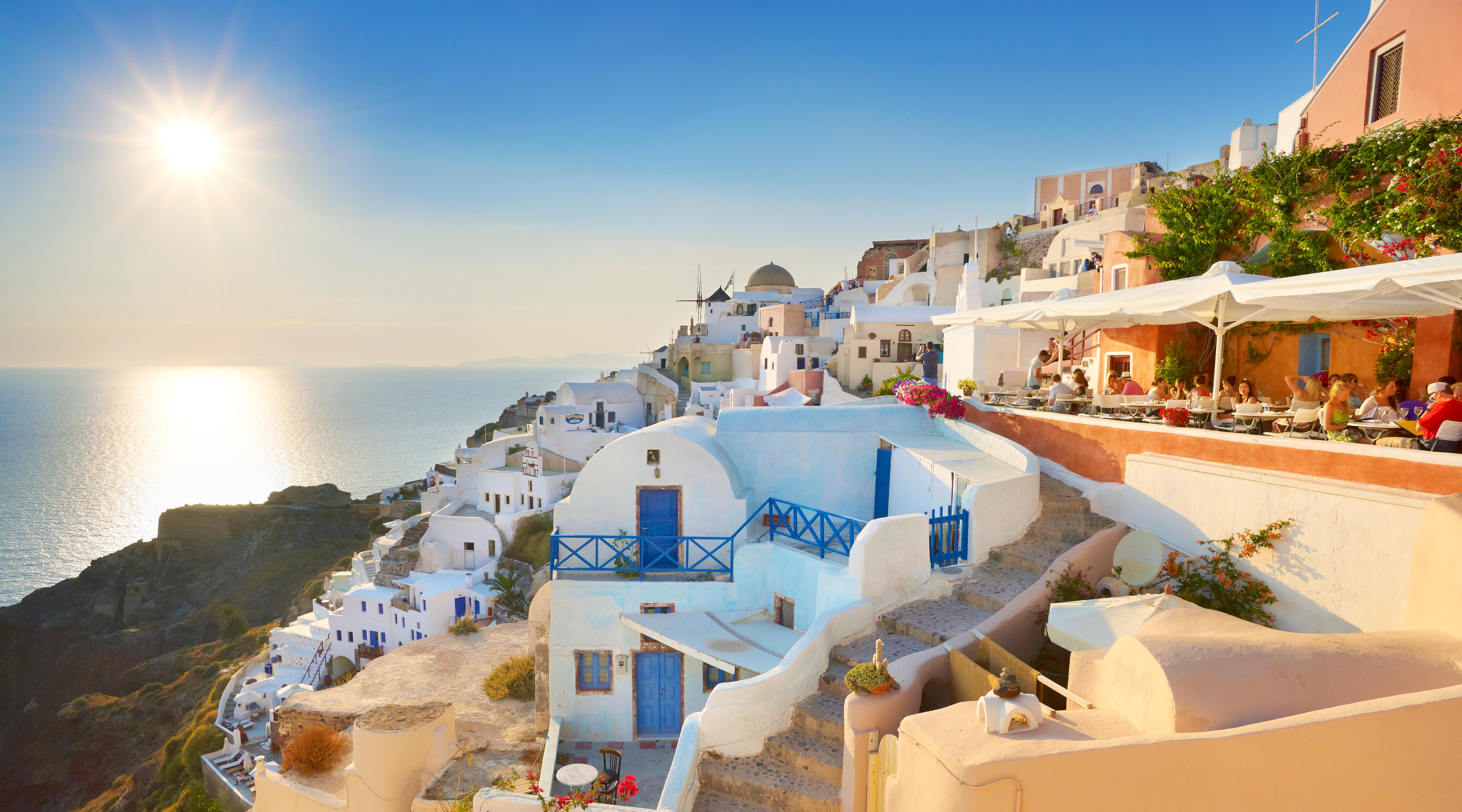 Enjoy pretty whitewashed villages and stunning sunsets in romantic Santorini