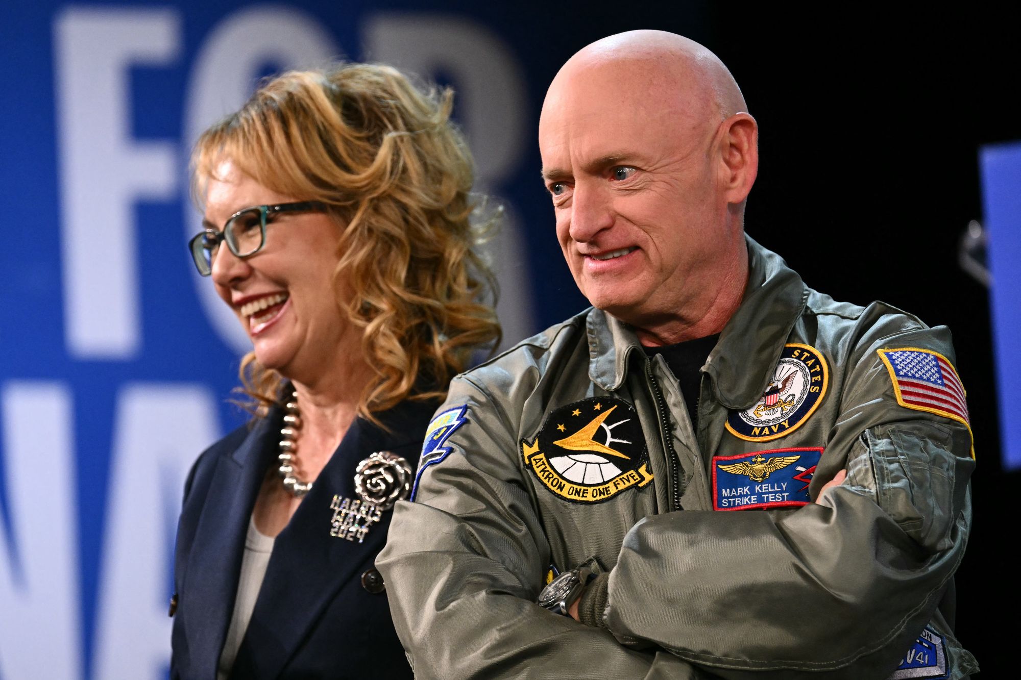 Kelly and his wife, former Congresswoman Gabby Giffords, on stage at a campaign event for former Vice President Kamala Harris in November 2024
