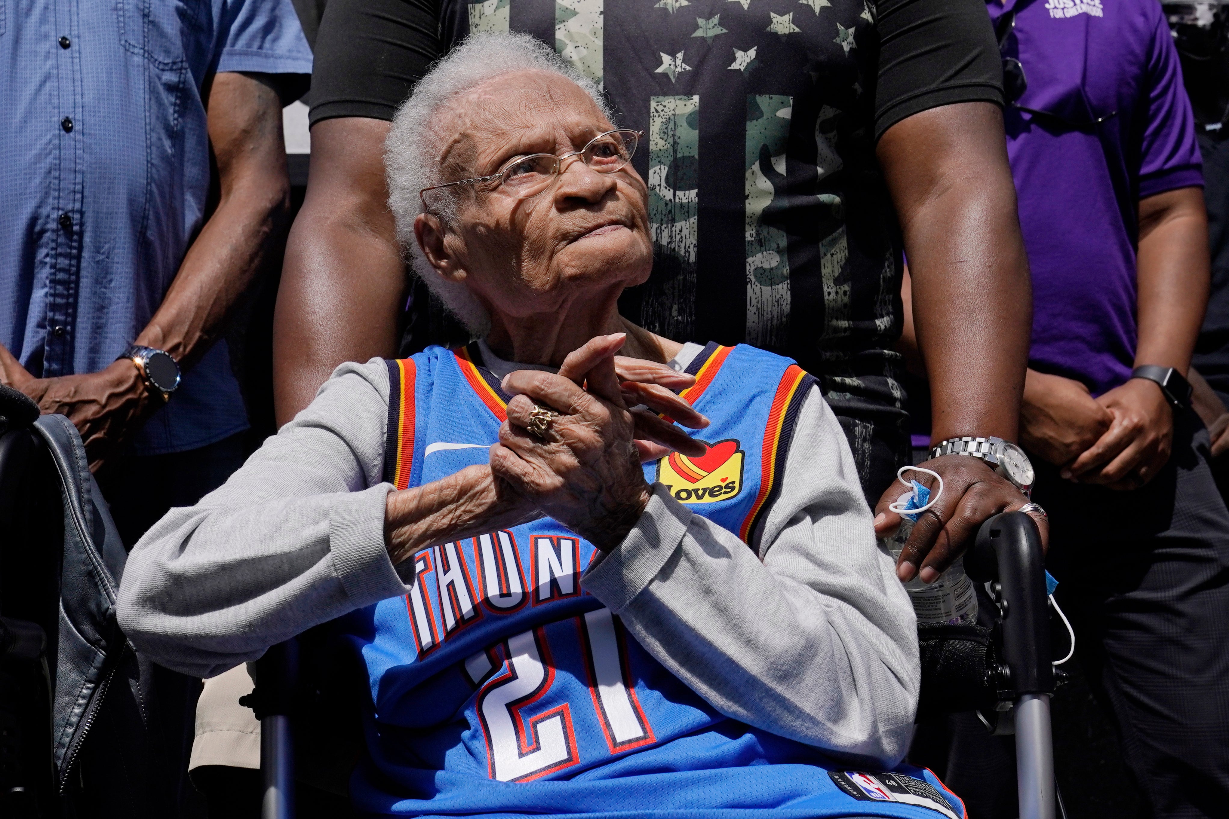 FILE - Tulsa Race Massacre survivor Viola Ford Fletcher listens during a rally marking centennial commemorations of a two-day assault by armed white men on Tulsa's prosperous Black community of Greenwood, May 28, 2021, in Tulsa, Okla.