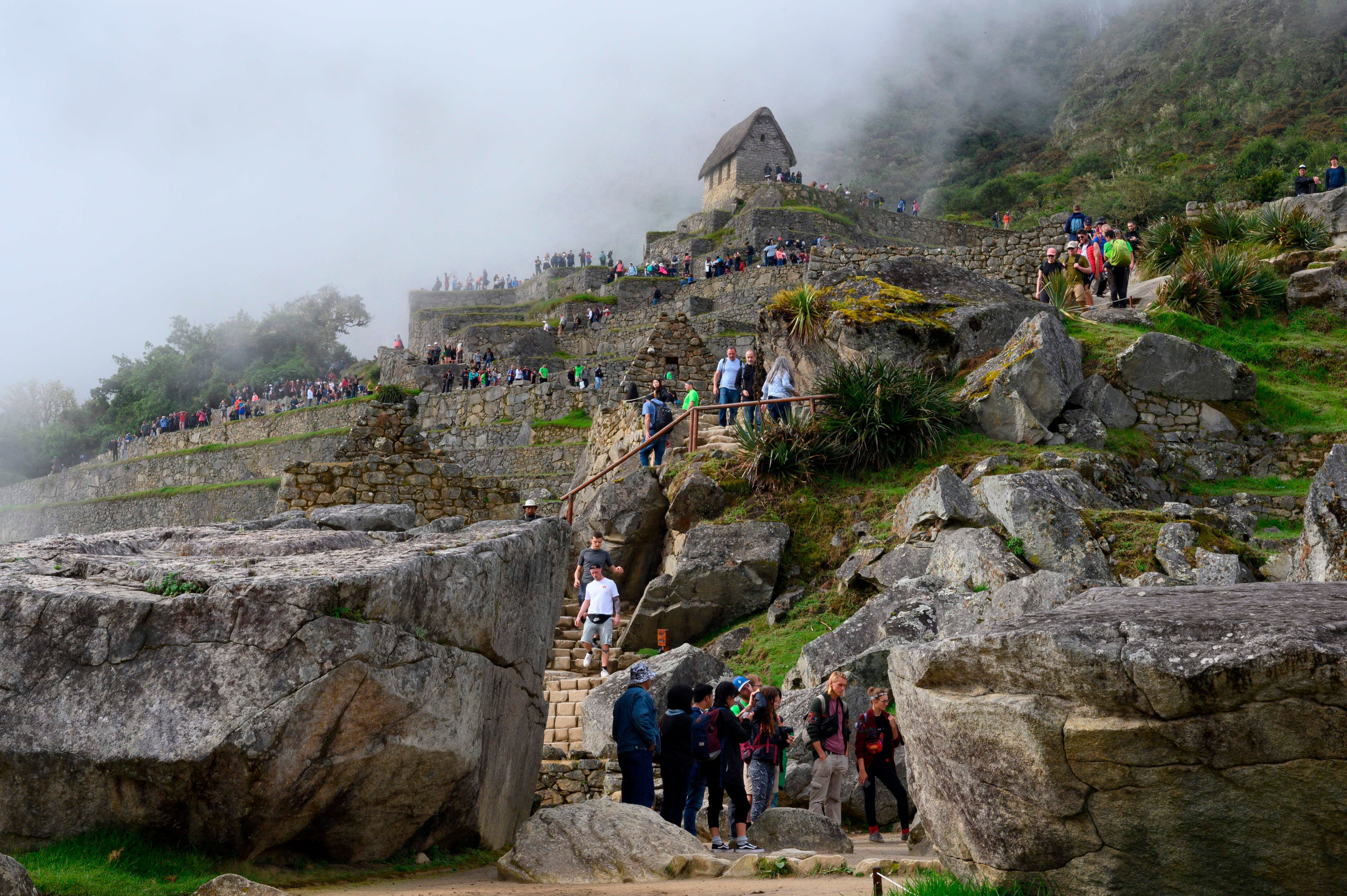 Tourists visit the Machu Picchu complex