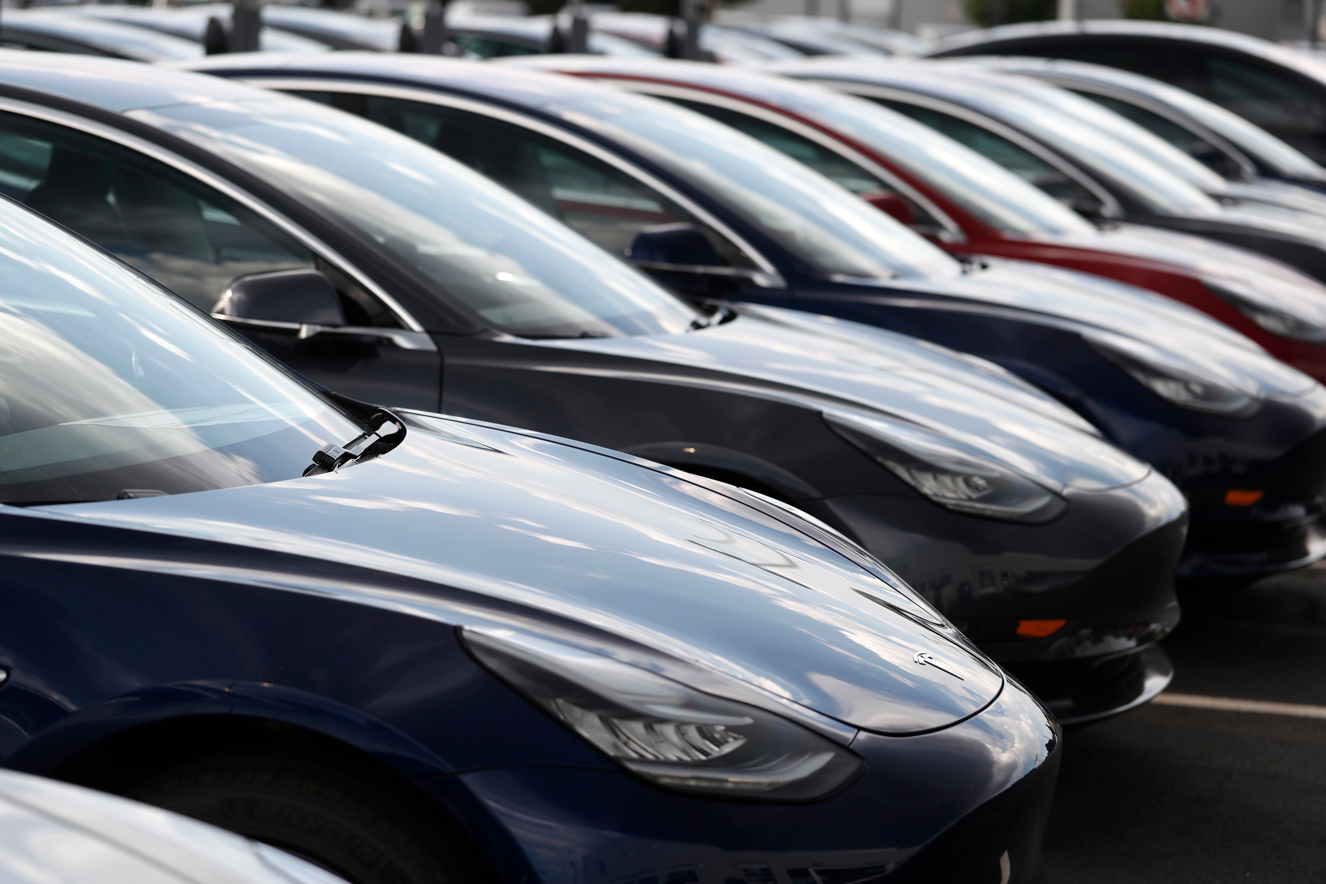 Tesla cars on a forecourt