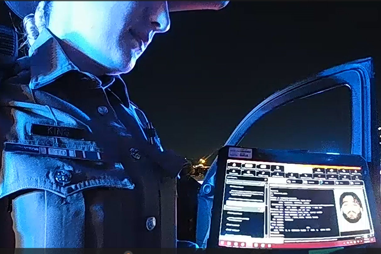 Bodycam footage shows law enforcement looking up information about Cowboys defensive end Marshawn Kneeland while searching for him