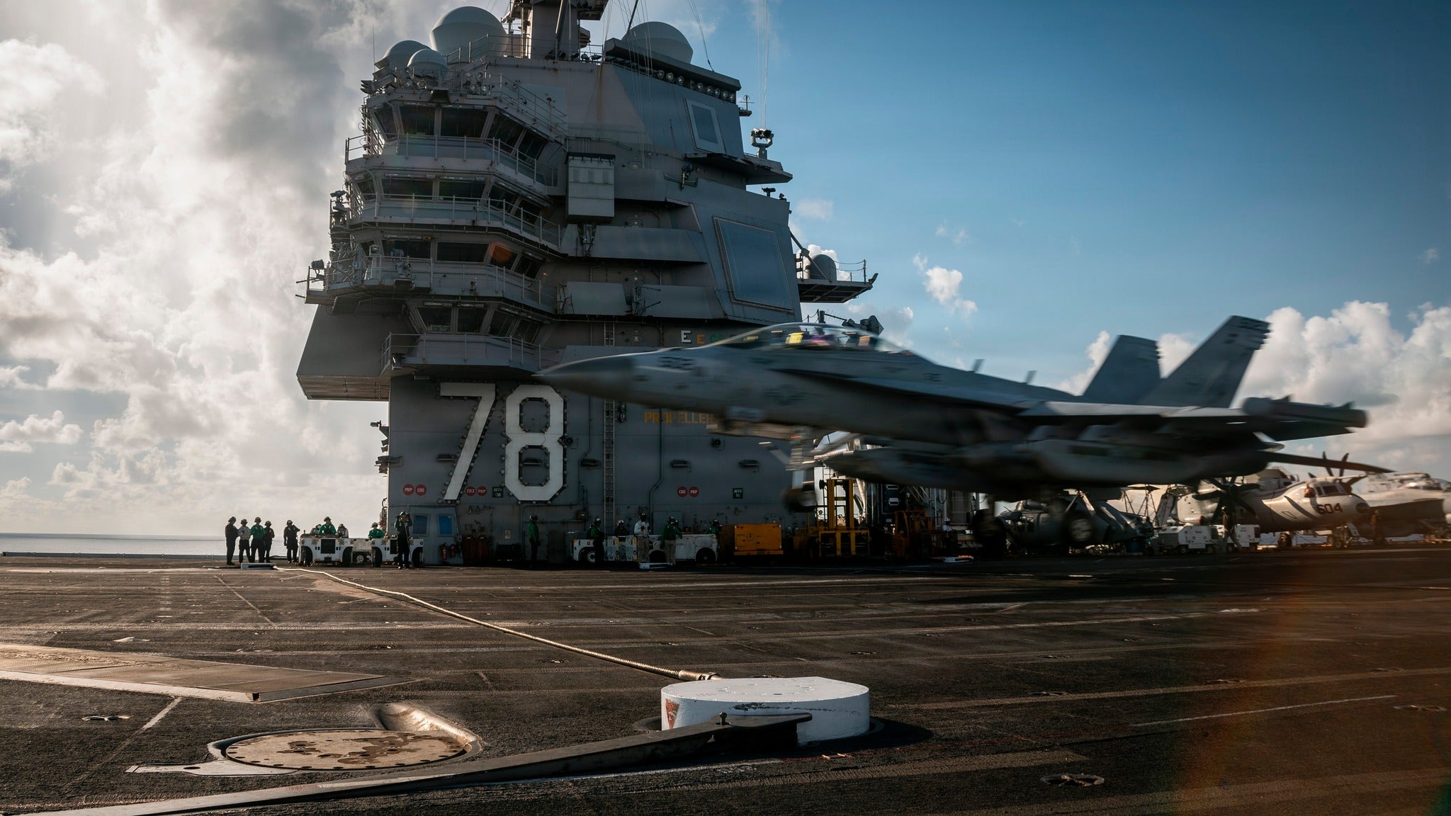 An E/A-18G Growler aircraft lands on the flight deck of USS Gerald R. Ford