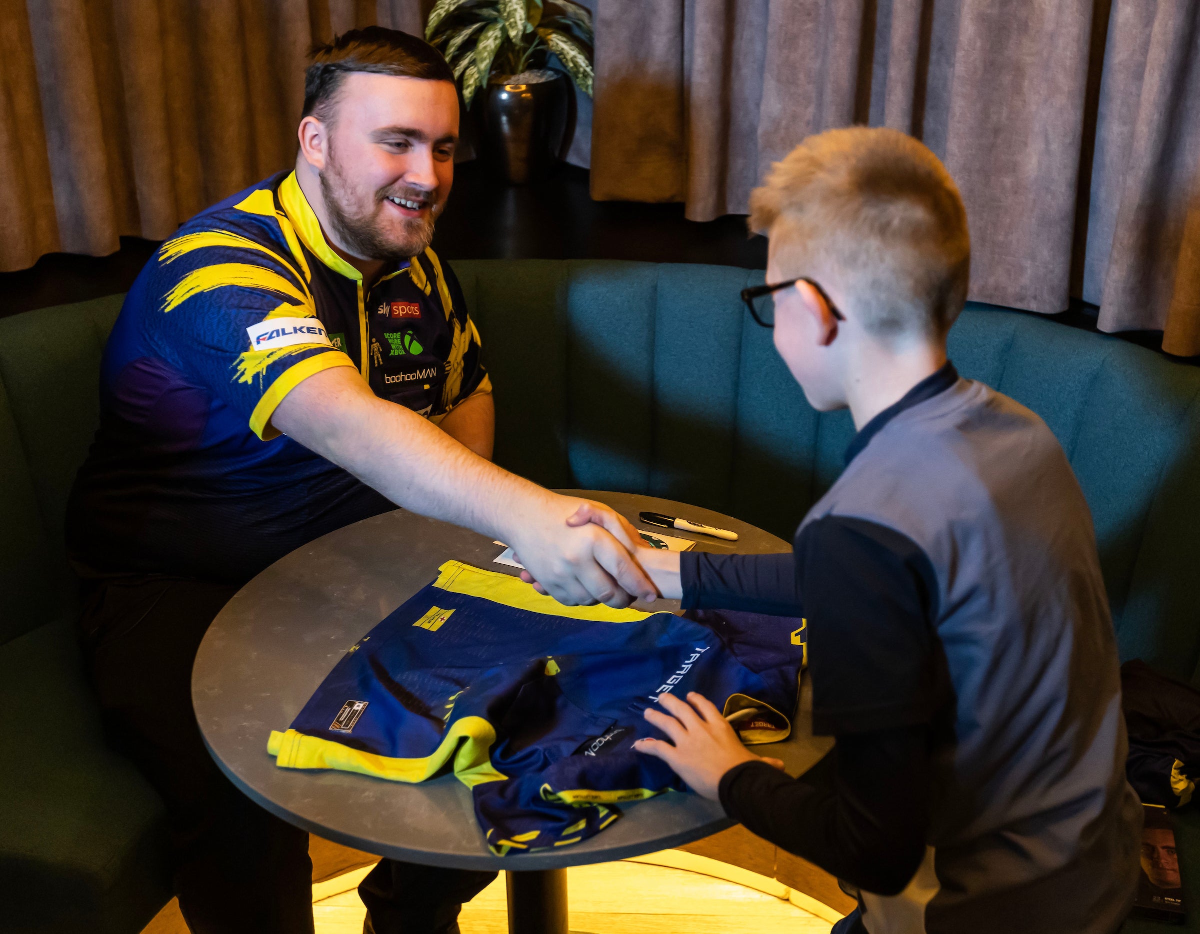 Littler meets young fan Josh before the World Championship draw