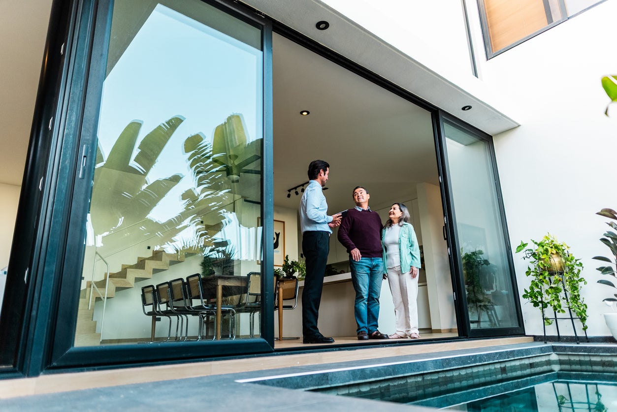 Real estate experts are split on whether rising luxury home prices impact the wider market