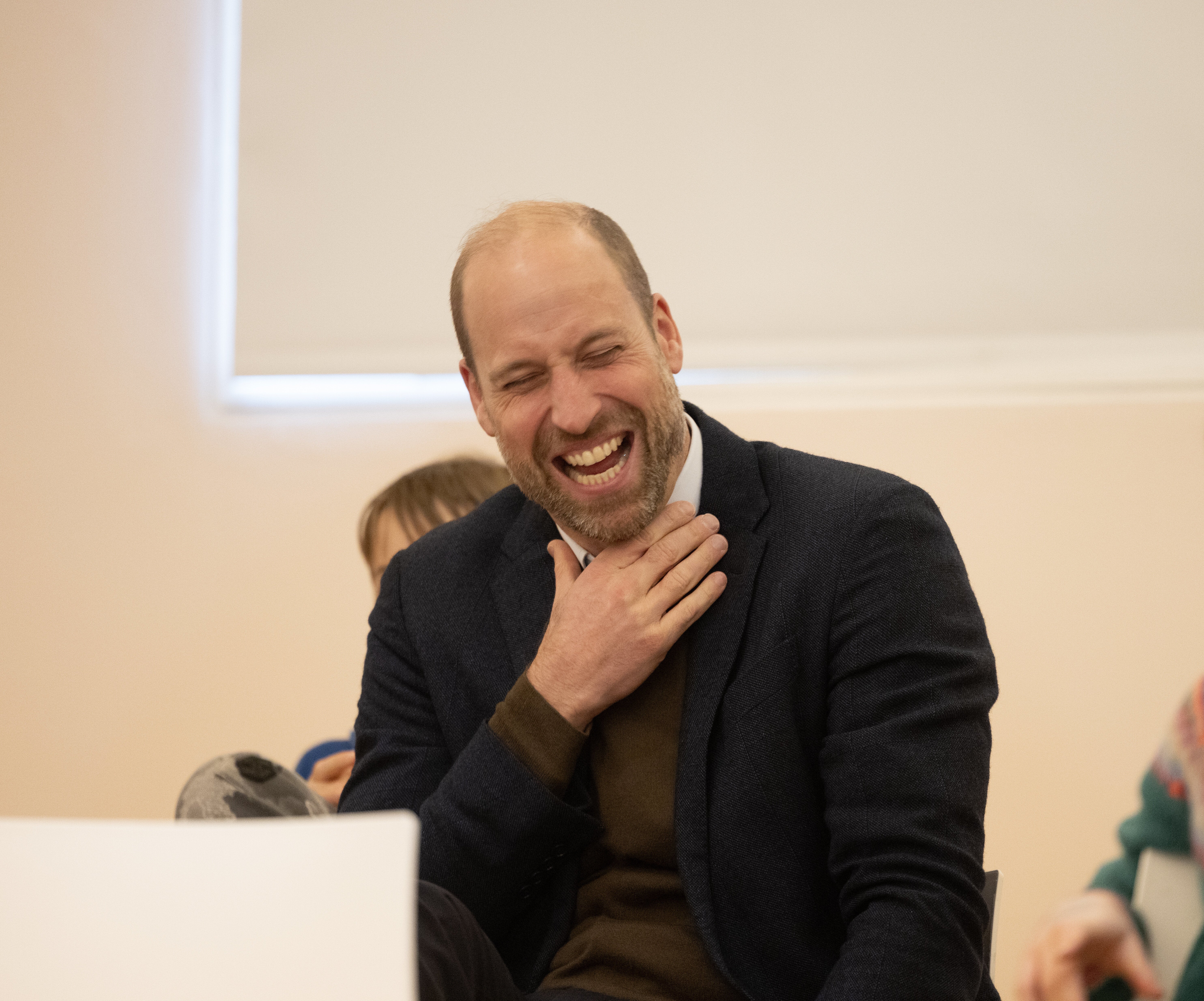 The Prince of Wales has his funny bone tickled while watching a comedy workshop